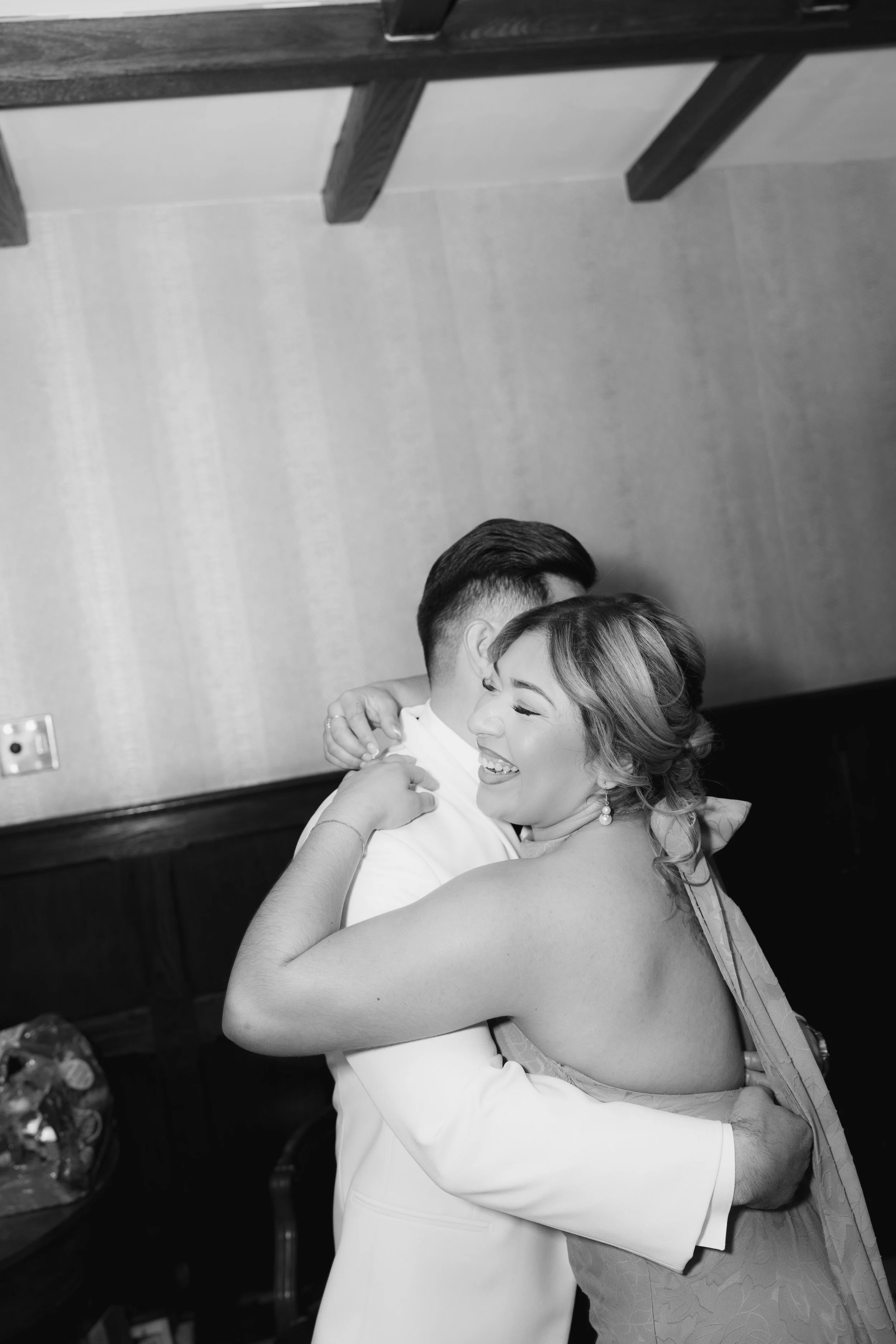 Groom getting ready at Hotel DuVillage before Andy & Elmer's May 2026 wedding. Captured by Raw By Laura using a blend of digital and 35mm film photography, documenting genuine moments with family and friends.