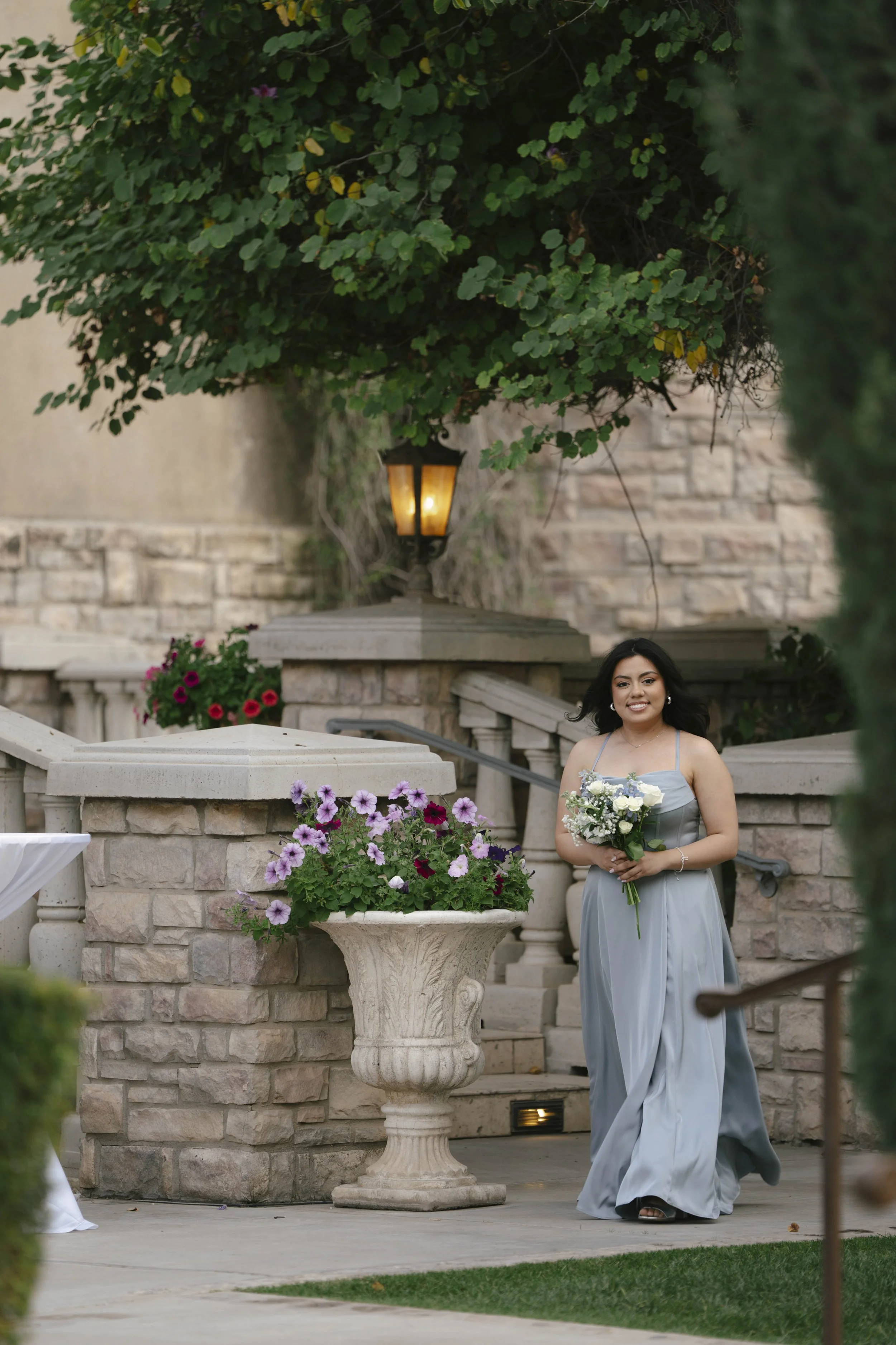 Ceremony details at Ashley Castle in Chandler, Arizona, were thoughtfully captured through hybrid film and digital photography, highlighting elegant signage, romantic seating displays, and the bridesmaid processional as guests gathered for this timel