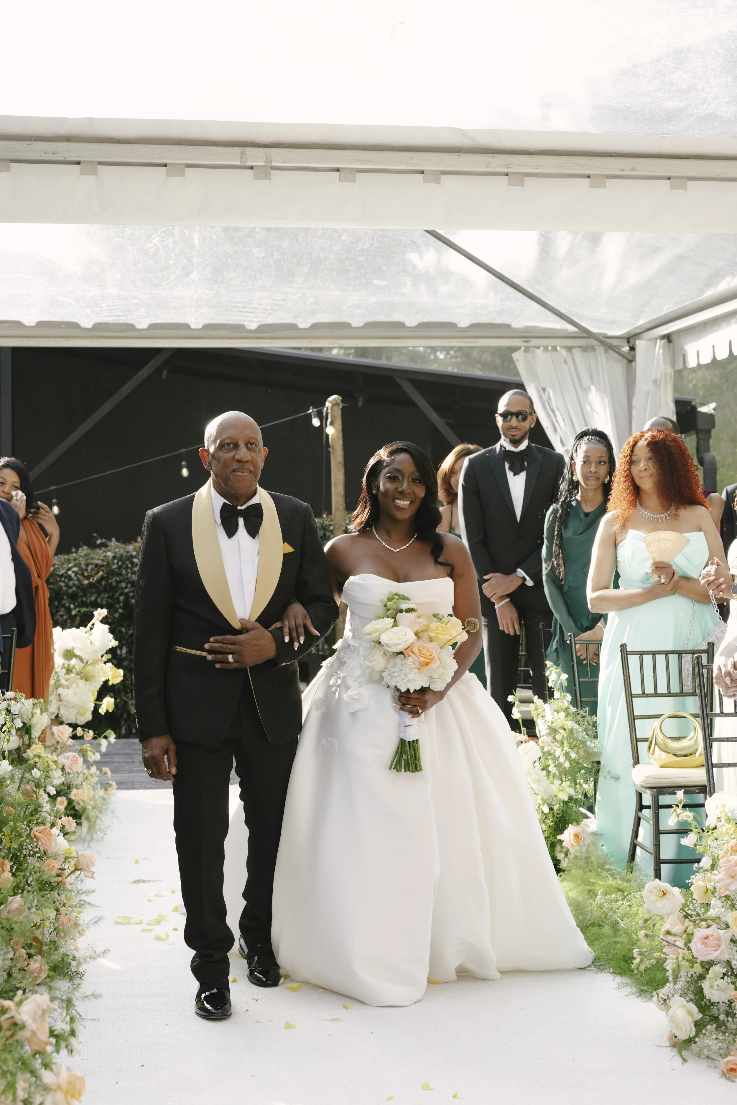Forest Campestre wedding ceremony in Medellín, Colombia featuring the bridal processional, groom's reaction, emotional ceremony moments, floral aisle design, wedding guests, and documentary-style wedding photography
