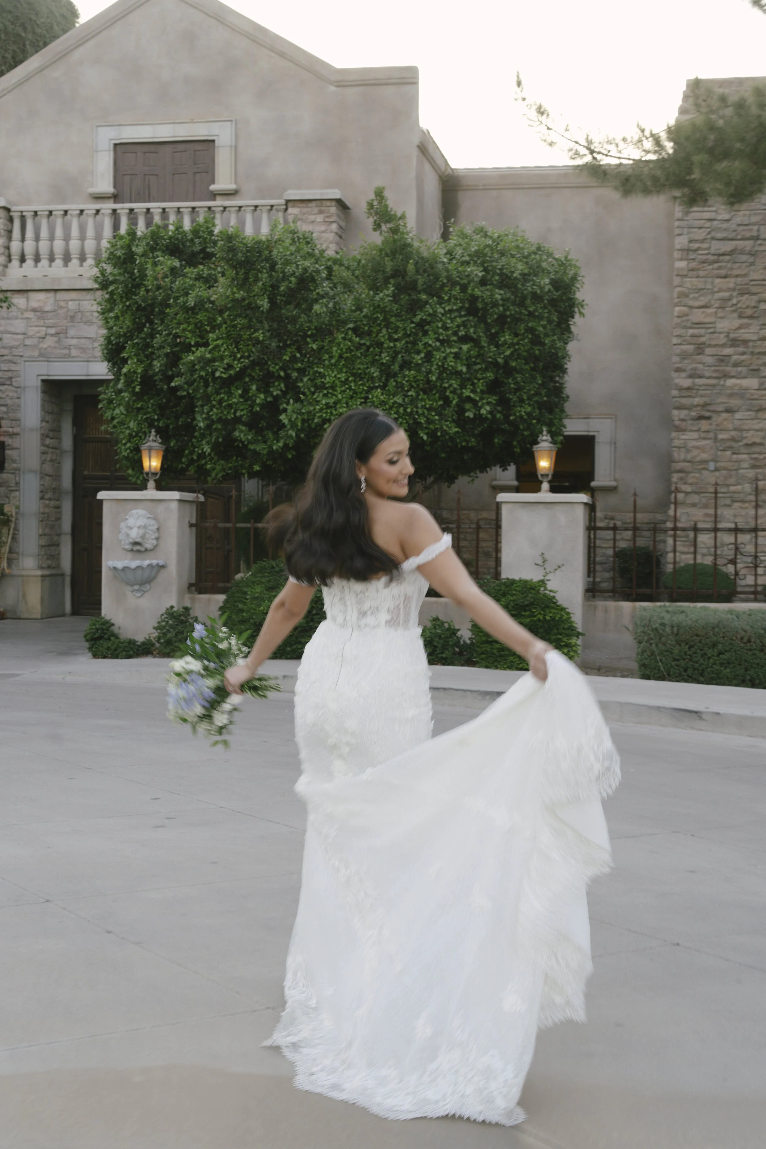 Bridal portraits at Ashley Castle in Chandler, Arizona, were captured through hybrid film and digital photography, showcasing the bride’s timeless elegance alongside her bridesmaids in the castle’s romantic courtyard gardens with soft evening light a