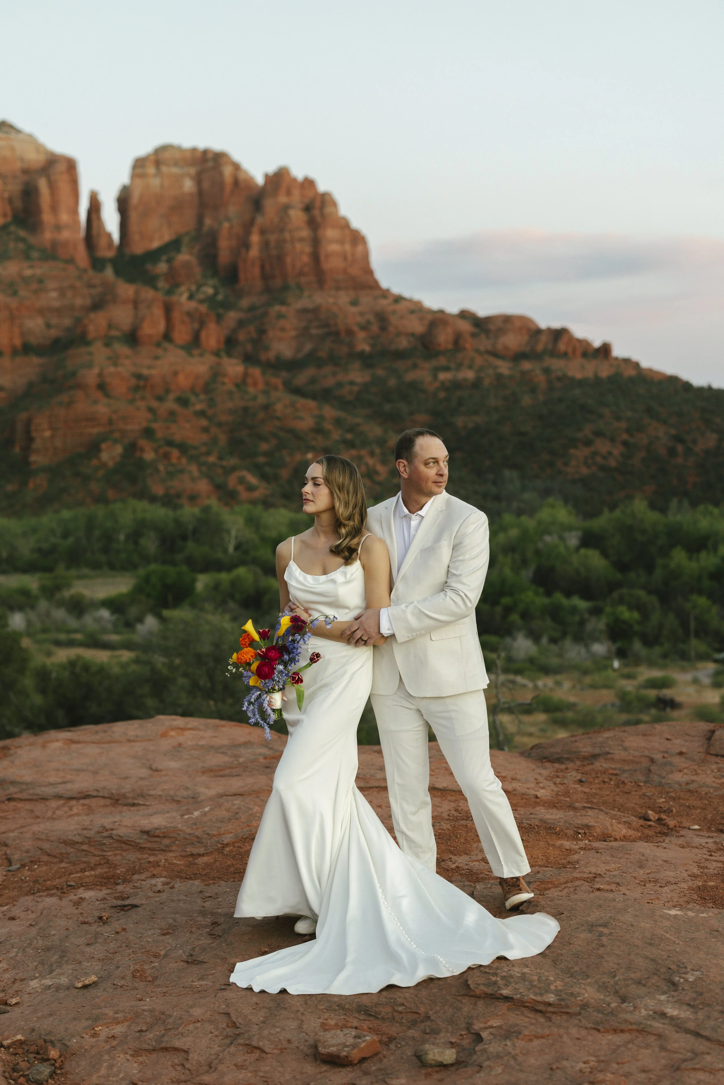 Romantic golden hour portraits at Secret Slick Rock during Chelsea and Travis' intimate Sedona elopement. Featuring Sedona's famous red rock views, stunning Arizona desert landscapes, and timeless wedding photography, these newlywed portraits perfect
