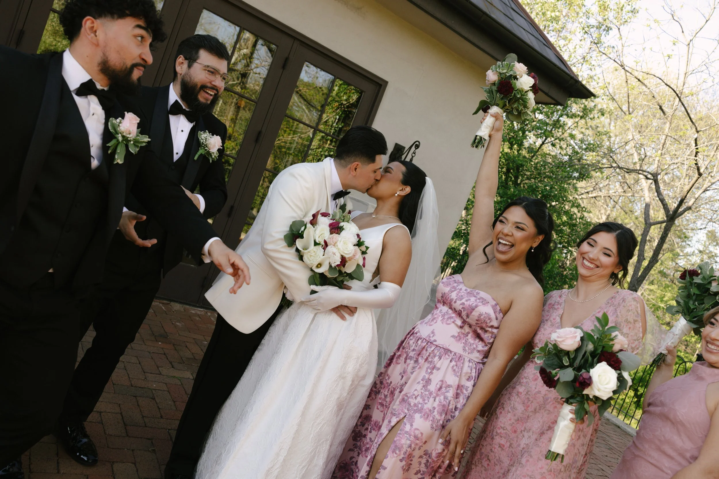 Bridal party portraits at Hotel DuVillage celebrate the bride and groom alongside their closest friends and family. Captured on digital and 35mm film, these images highlight genuine laughter, timeless portraits, and unforgettable moments.
