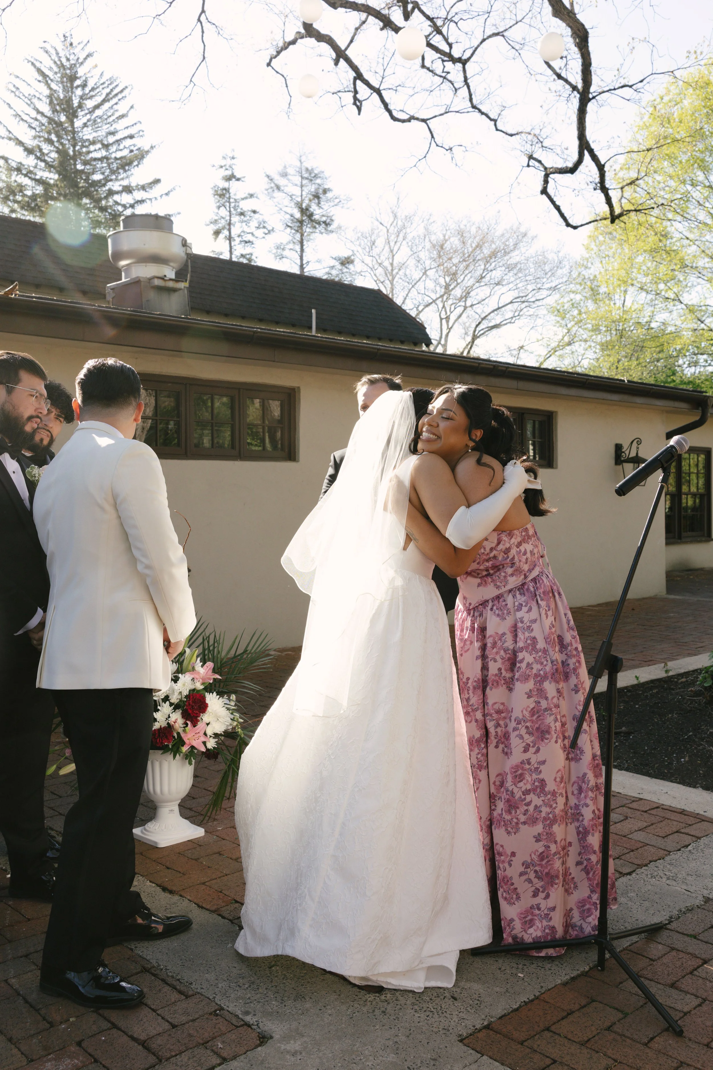 Outdoor wedding ceremony at Hotel DuVillage featuring the bride and groom, wedding party, and meaningful moments captured on both digital and 35mm film. A timeless celebration documented with a candid, documentary approach