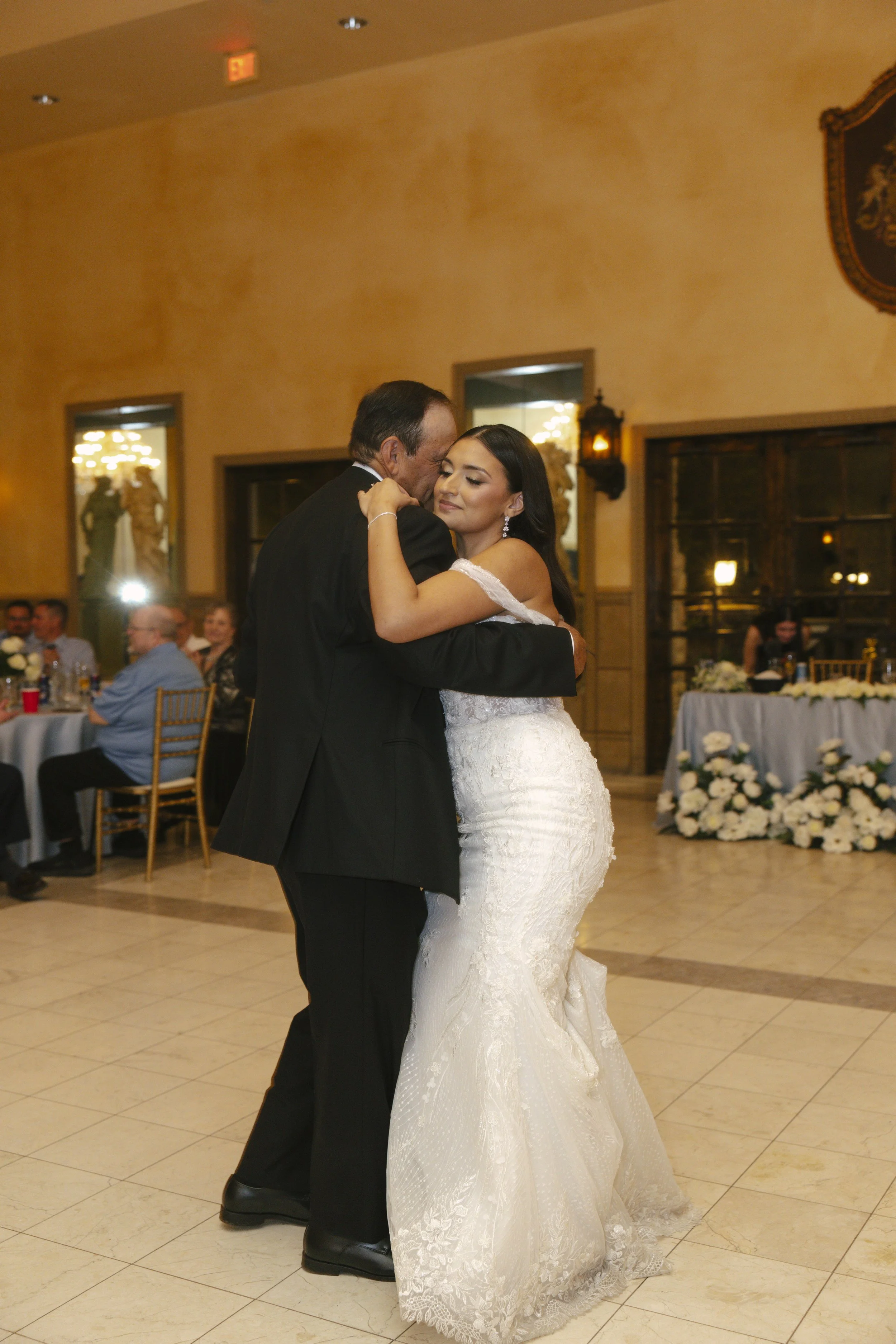 The reception celebration at Ashley Castle in Chandler, Arizona, came to life through hybrid film and digital photography, capturing elegant reception details, joyful bridal party entrances, and lively dance floor moments inside the castle’s grand ba
