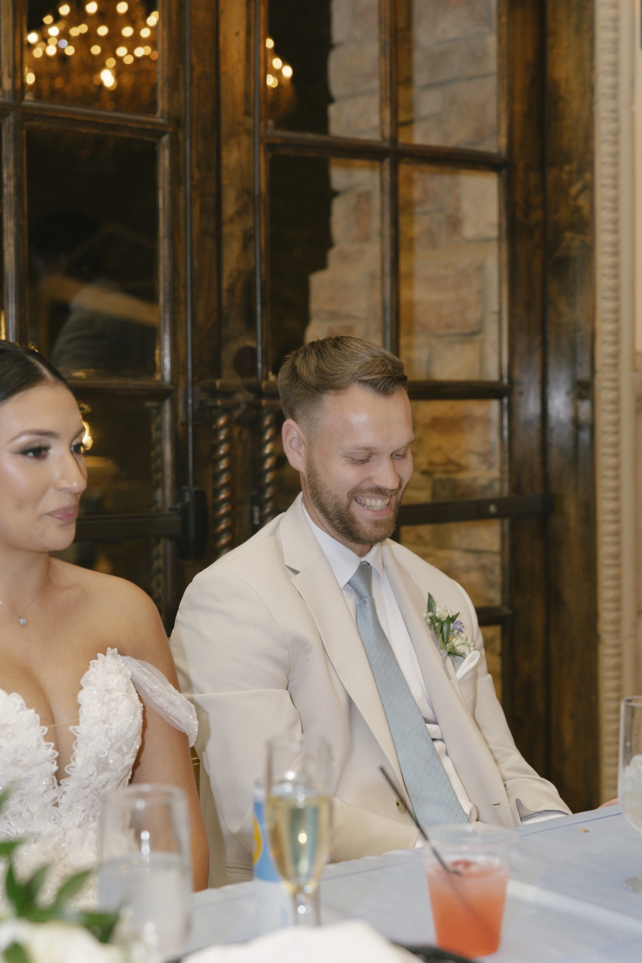 The reception celebration at Ashley Castle in Chandler, Arizona, came to life through hybrid film and digital photography, capturing elegant reception details, joyful bridal party entrances, and lively dance floor moments inside the castle’s grand ba