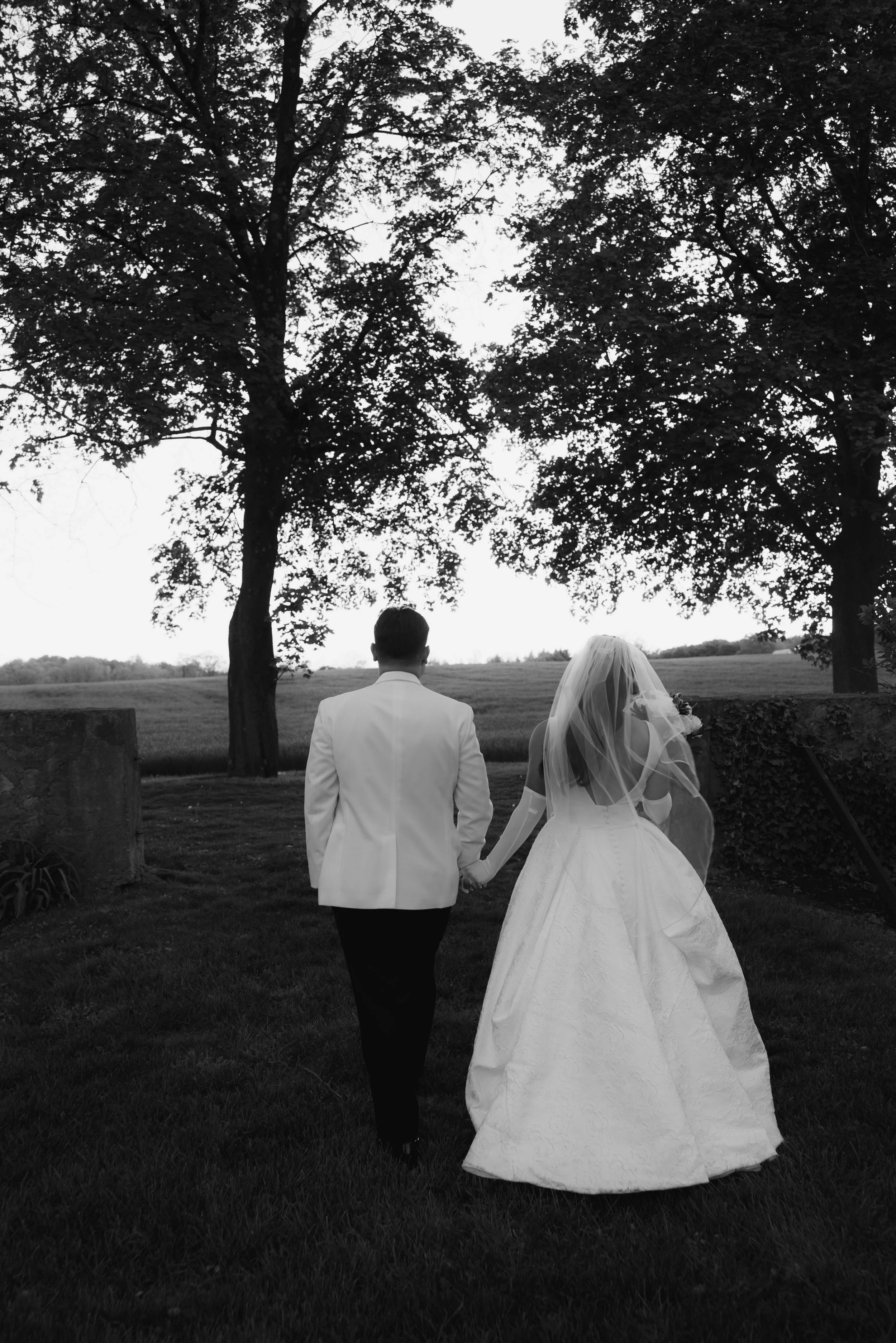 As the sun began to set, the bride and groom stepped away for golden hour portraits around the grounds of Hotel DuVillage. Captured on both digital and 35mm film, these sunset portraits highlight the warmth, romance, and quiet moments shared between 