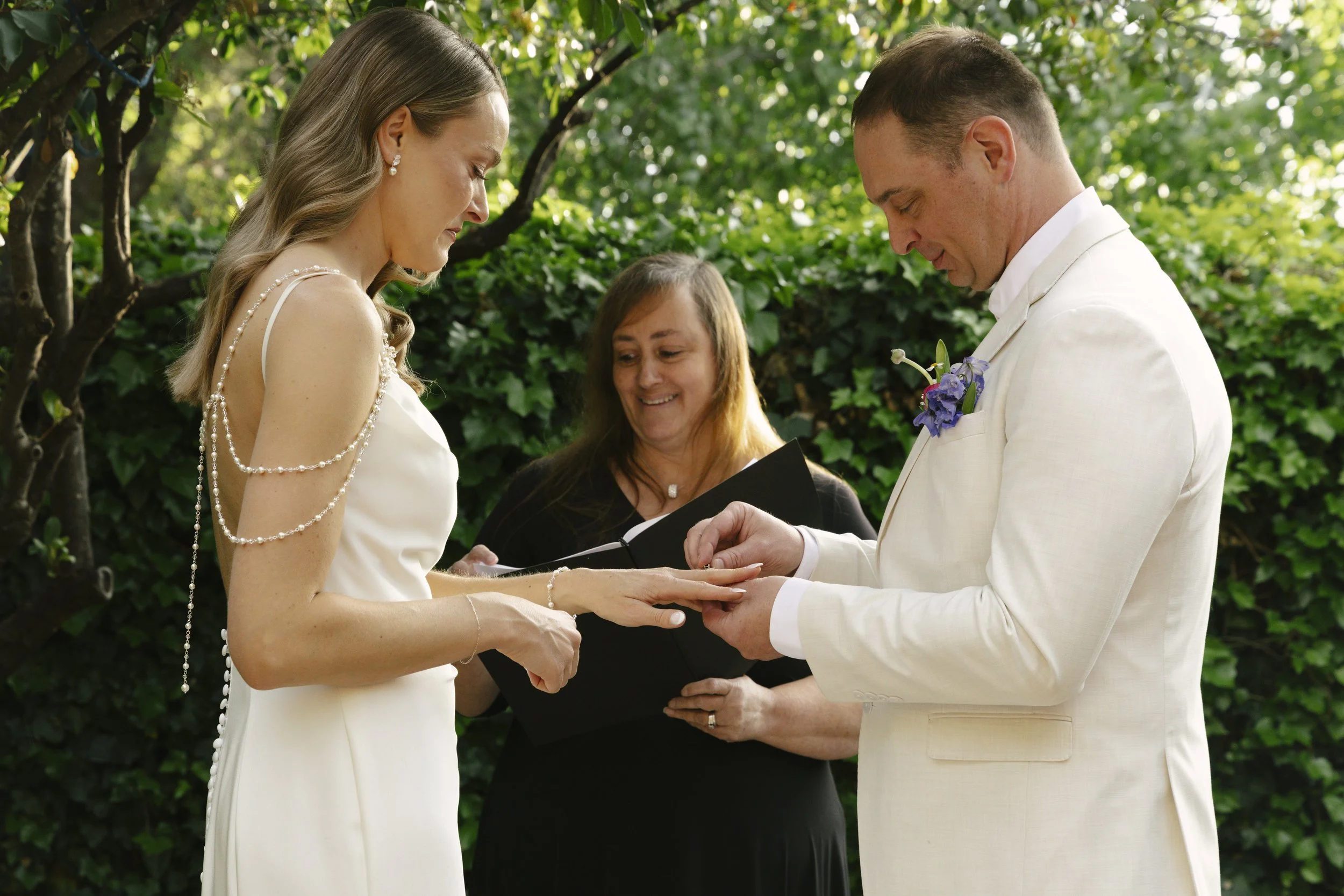 Chelsea and Travis exchanged heartfelt vows during their intimate Sedona elopement at a private Arizona home, surrounded by their closest family, friends, and beloved dog. Their outdoor ceremony was filled with meaningful moments, personal vows, and 