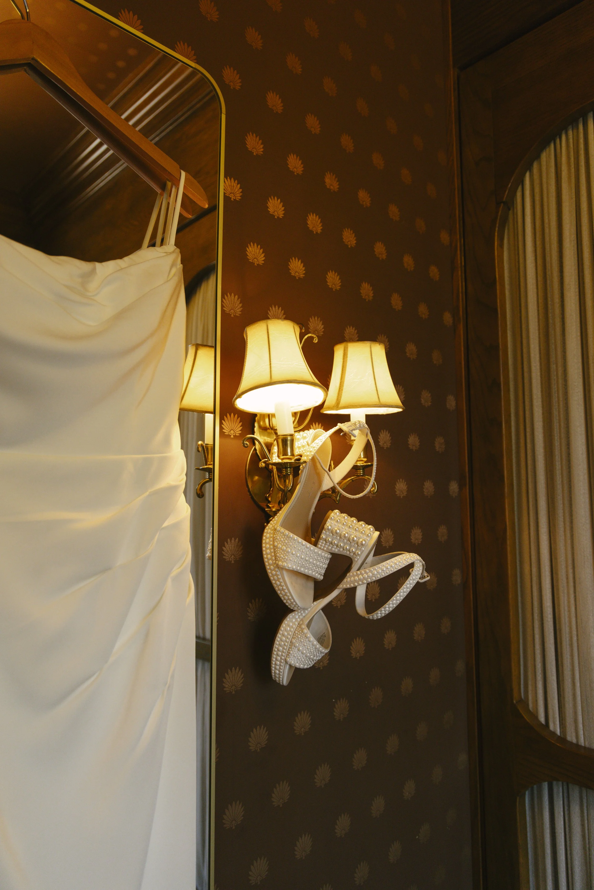 Elegant bridal details from Chelsea and Travis' intimate Sedona elopement, featuring the bride's wedding dress, shoes, rings, jewelry, and vibrant bouquet before getting ready for their private Arizona ceremony. Every carefully chosen detail reflecte