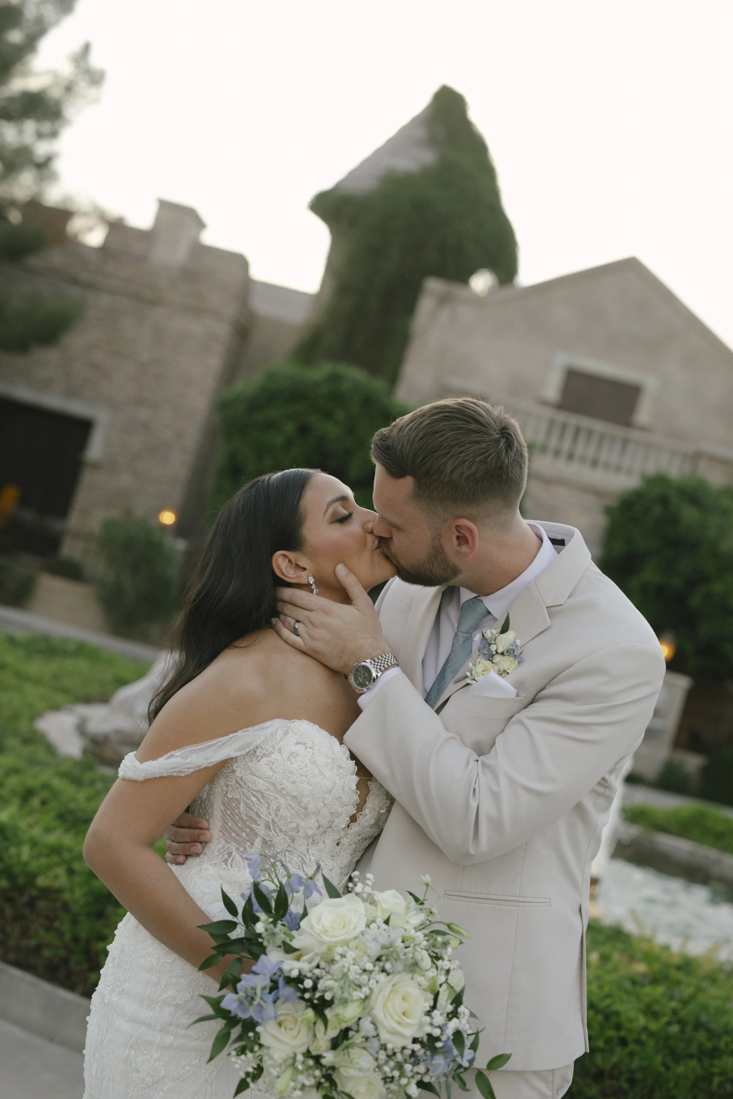 Intimate bride and groom portraits at Ashley Castle in Chandler, Arizona, were captured through hybrid film and digital photography, preserving romantic close-up moments filled with emotion, tenderness, and timeless newlywed connection.