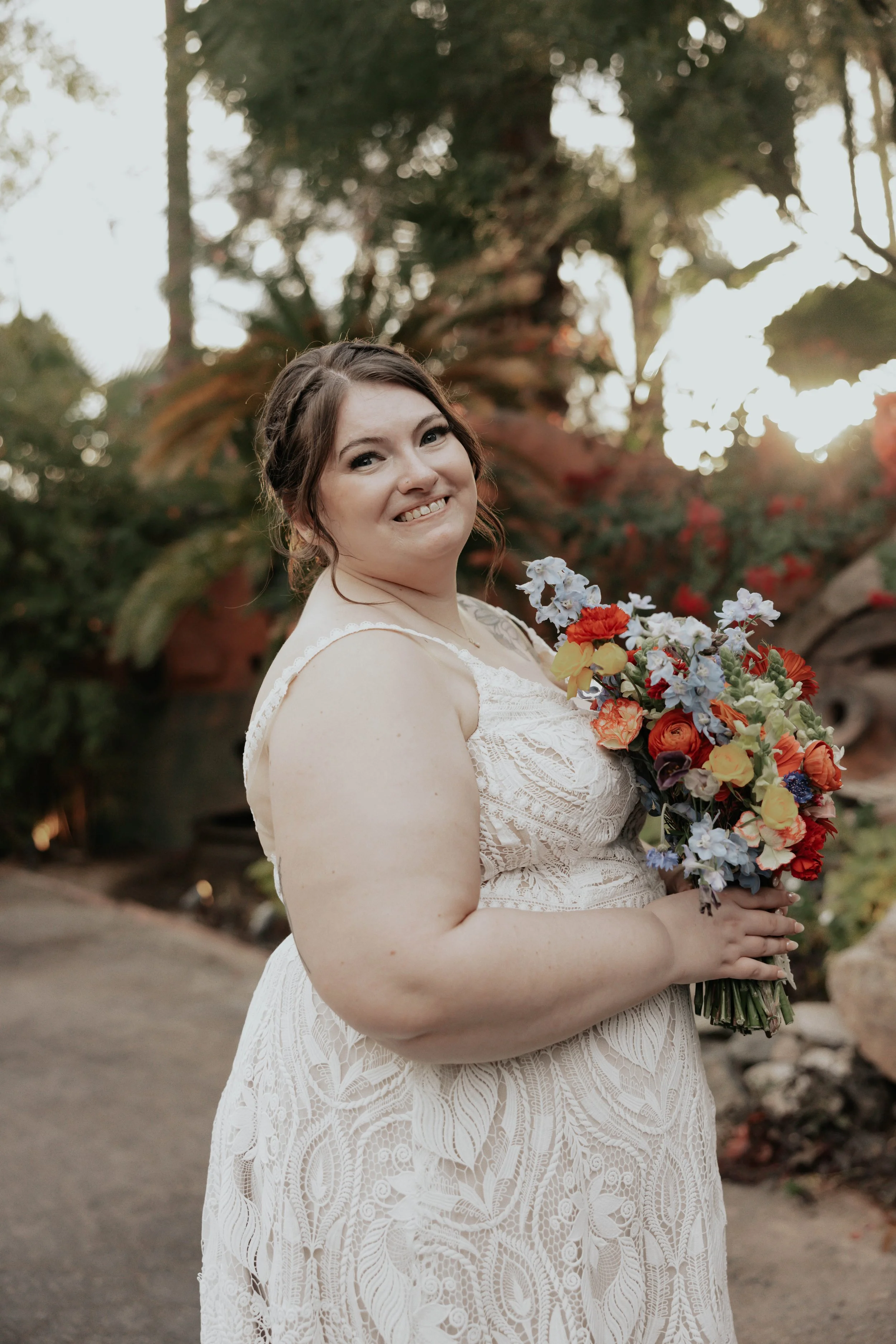 After the ceremony, Lauren and Joel explored the beautiful garden paths and adobe architecture of the Boojum Tree for their wedding portraits. Surrounded by desert greenery and warm Phoenix light, these moments captured the joy and excitement of thei