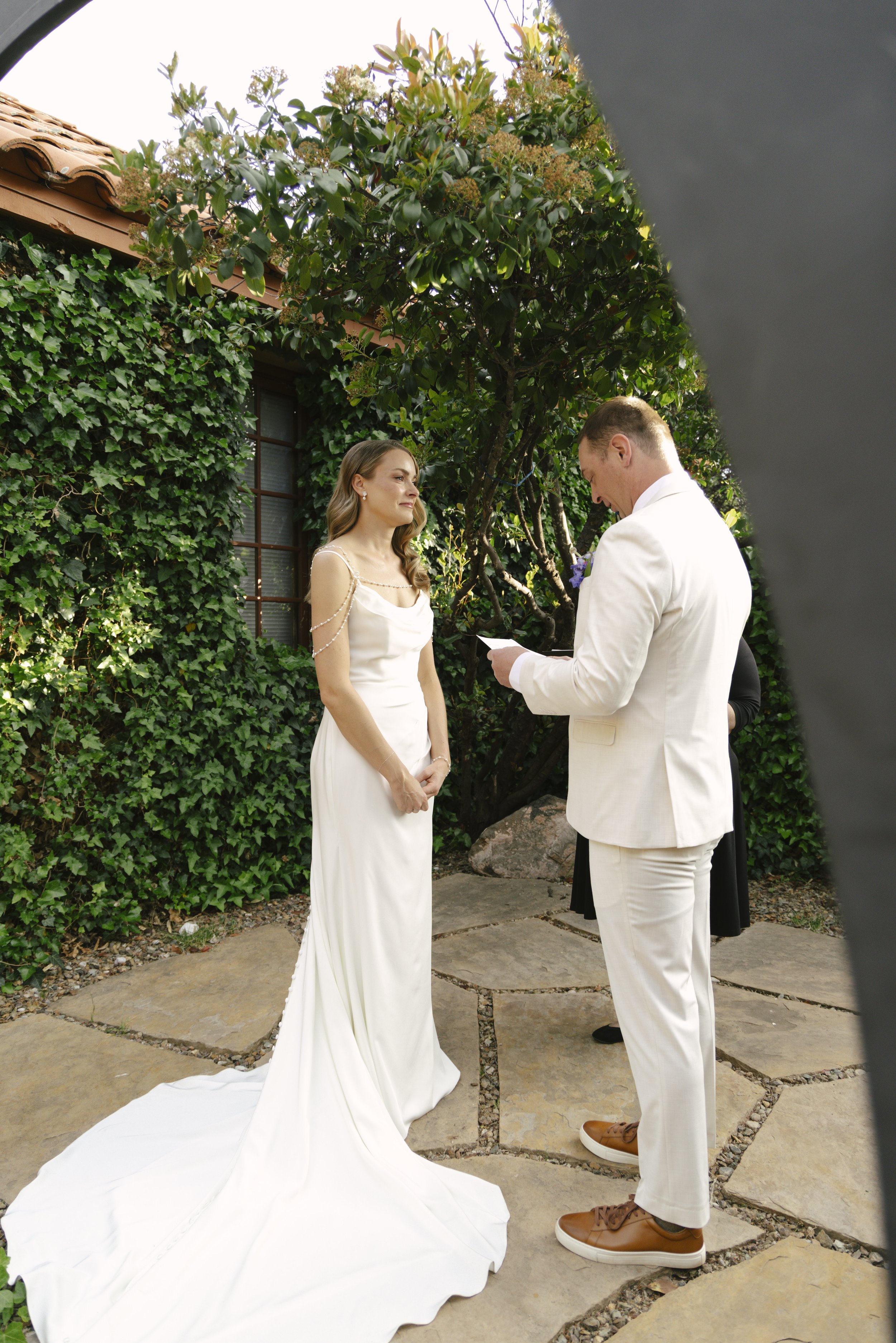 Chelsea and Travis exchanged heartfelt vows during their intimate Sedona elopement at a private Arizona home, surrounded by their closest family, friends, and beloved dog. Their outdoor ceremony was filled with meaningful moments, personal vows, and 