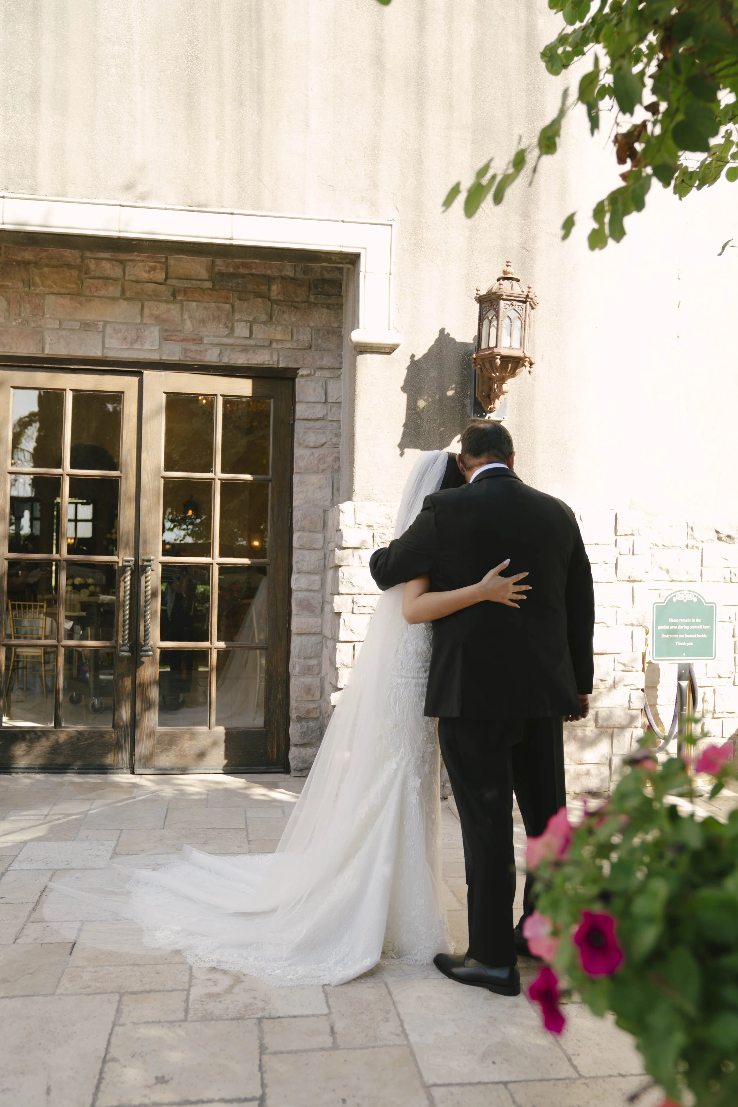 The bride’s first look with her father at Ashley Castle in Chandler, Arizona, was a heartfelt and emotional moment, beautifully documented through hybrid film and digital photography to preserve the joy, love, and anticipation shared before the cerem