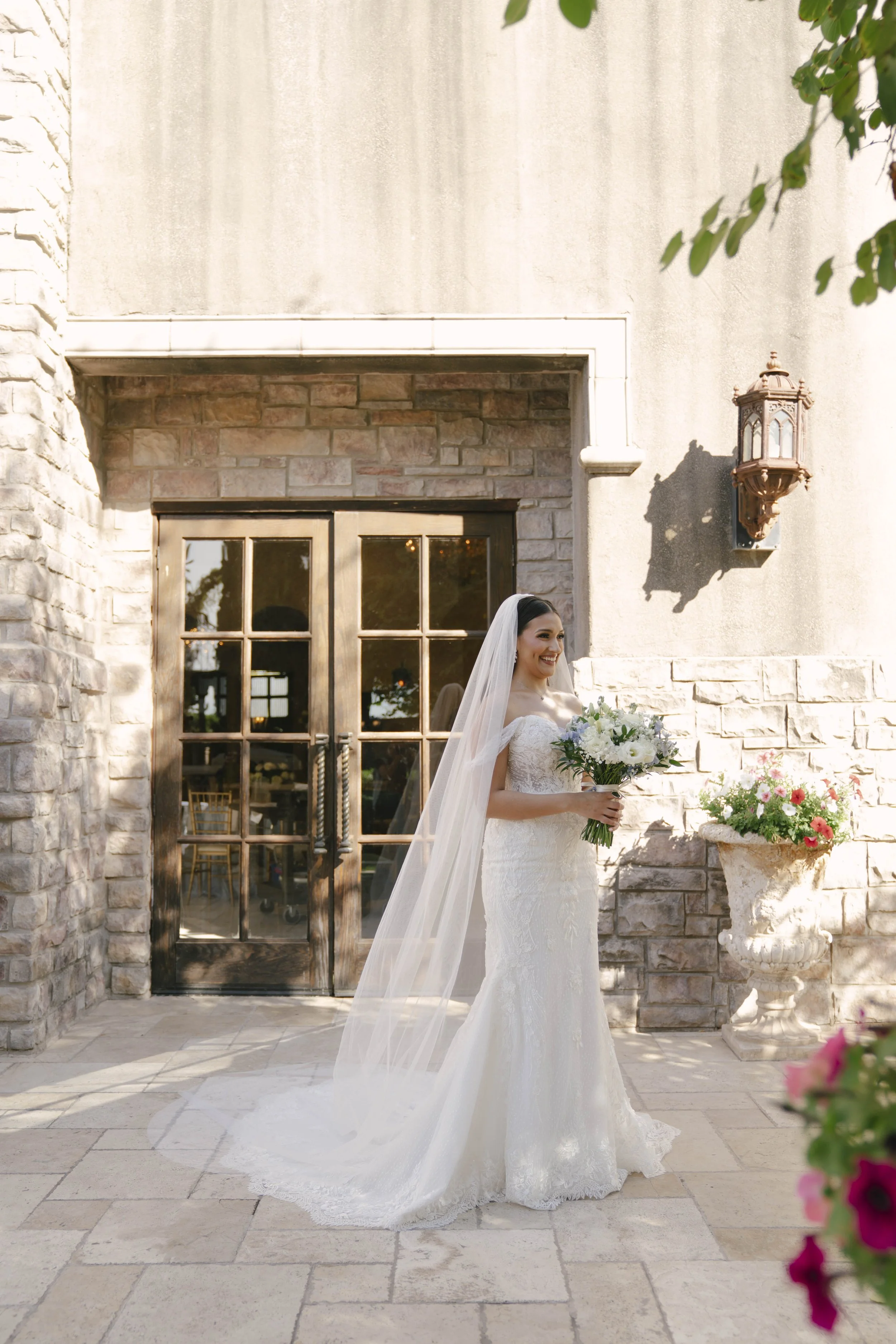The bride’s first look with her father at Ashley Castle in Chandler, Arizona, was a heartfelt and emotional moment, beautifully documented through hybrid film and digital photography to preserve the joy, love, and anticipation shared before the cerem