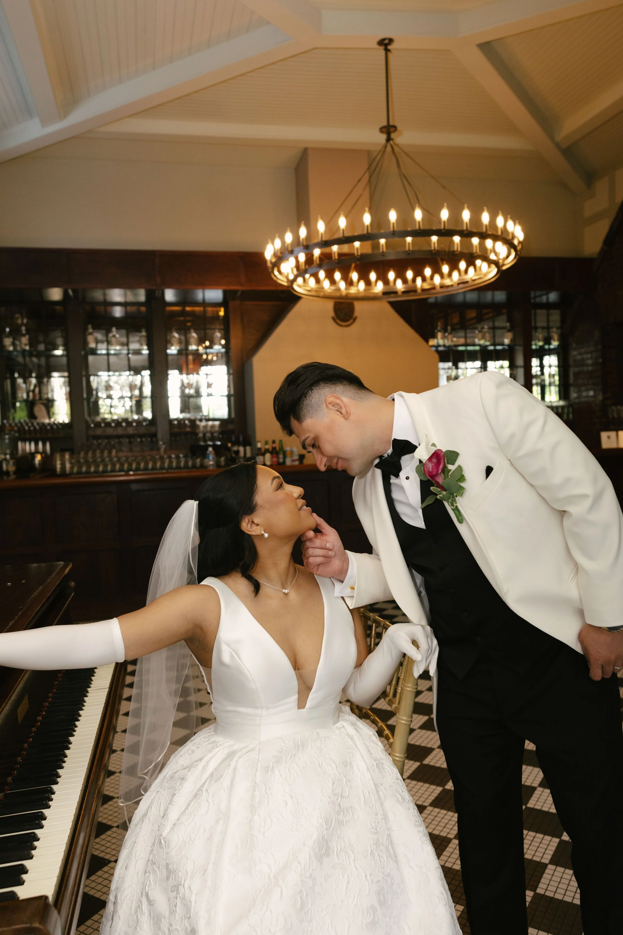 Bride and groom portraits at Hotel DuVillage showcase the venue's picturesque gardens, waterfront views, and timeless charm. Photographed on both digital and 35mm film, these wedding portraits focus on authentic connection, natural movement, and cand
