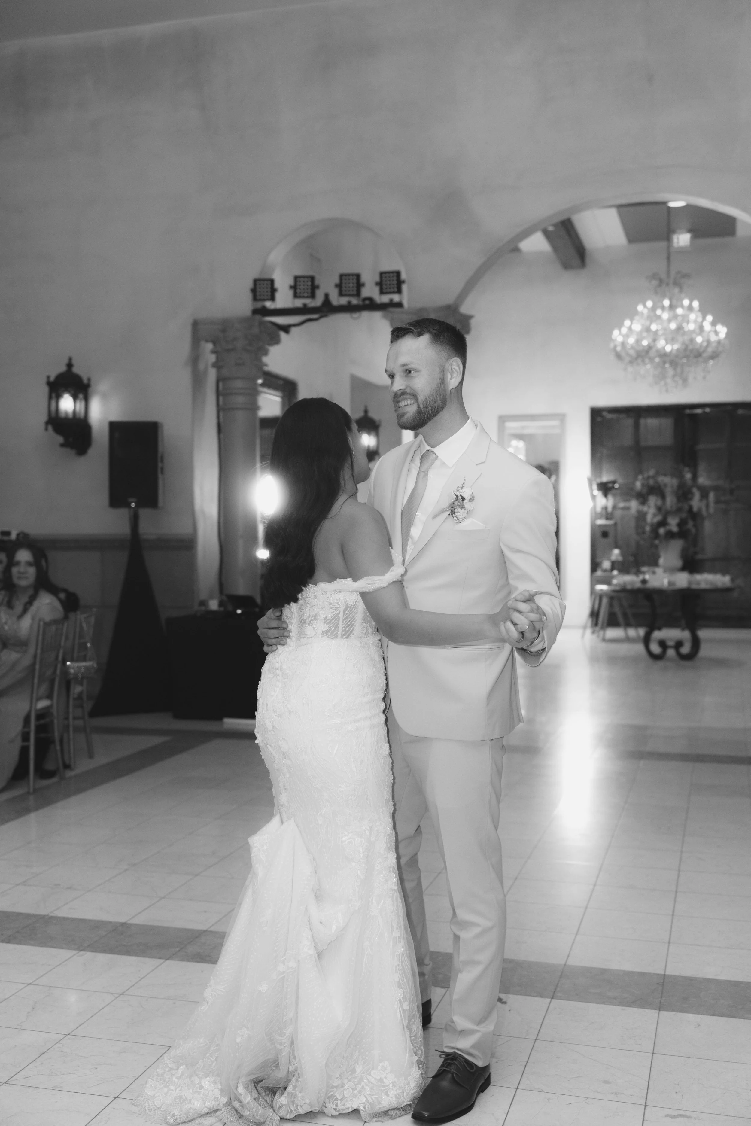 The reception celebration at Ashley Castle in Chandler, Arizona, came to life through hybrid film and digital photography, capturing elegant reception details, joyful bridal party entrances, and lively dance floor moments inside the castle’s grand ba