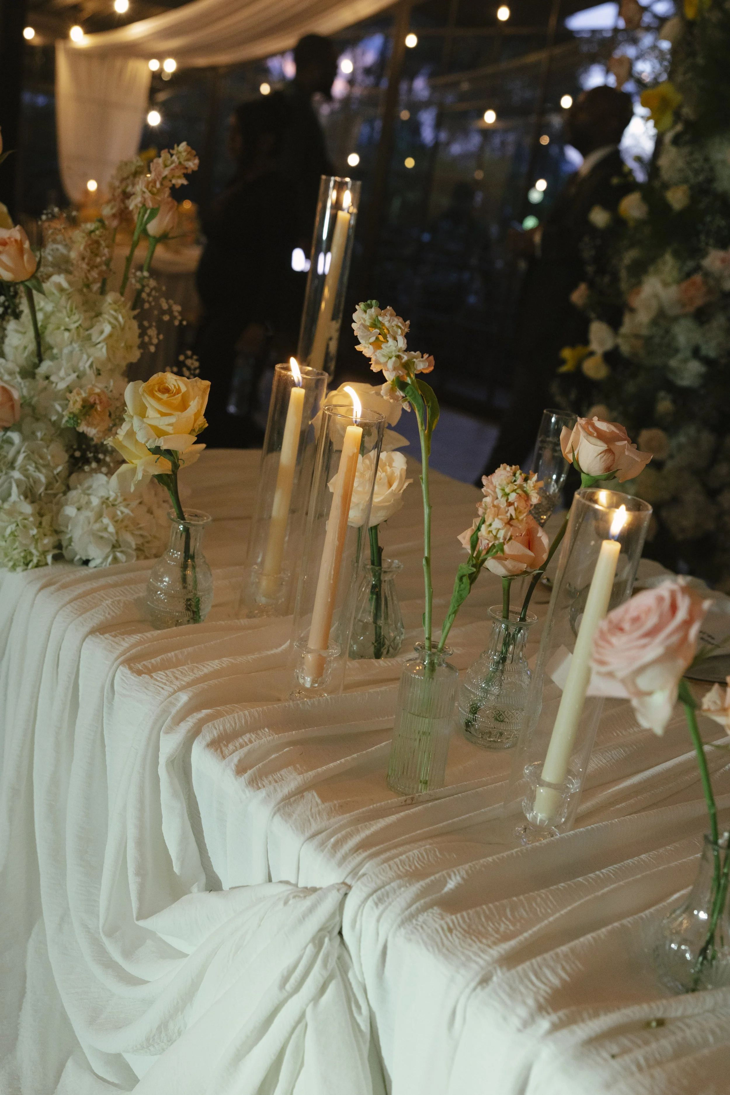 Wedding reception details at Forest Campestre in Medellín, Colombia featuring elegant reception décor, floral tablescapes, wedding cake, custom signage, first dance, and lively celebration captured through documentary wedding photography