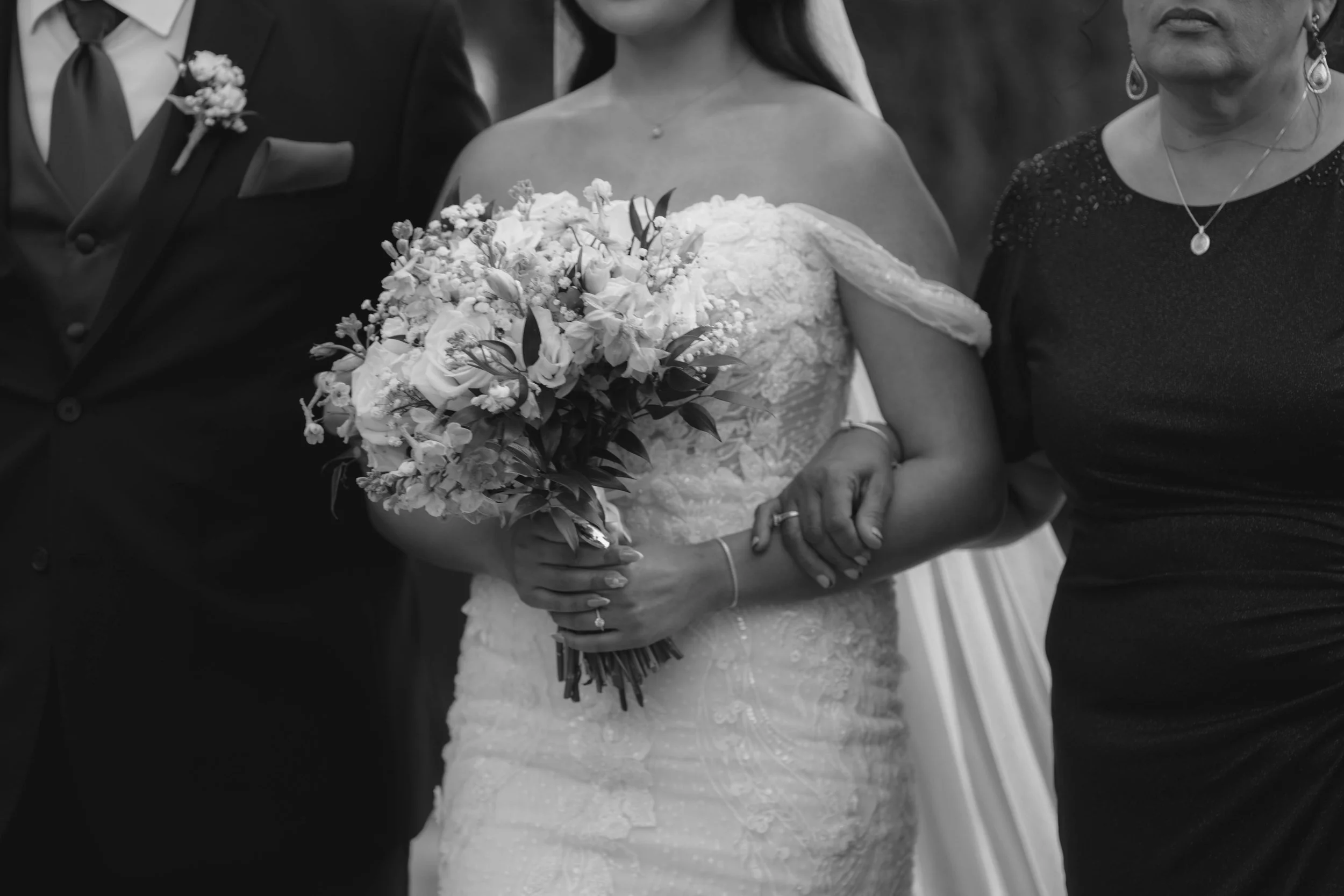 The wedding processional at Ashley Castle in Chandler, Arizona, was captured through hybrid film and digital photography, preserving the graceful entrances of the bridal party as they made their way through the romantic outdoor ceremony space surroun