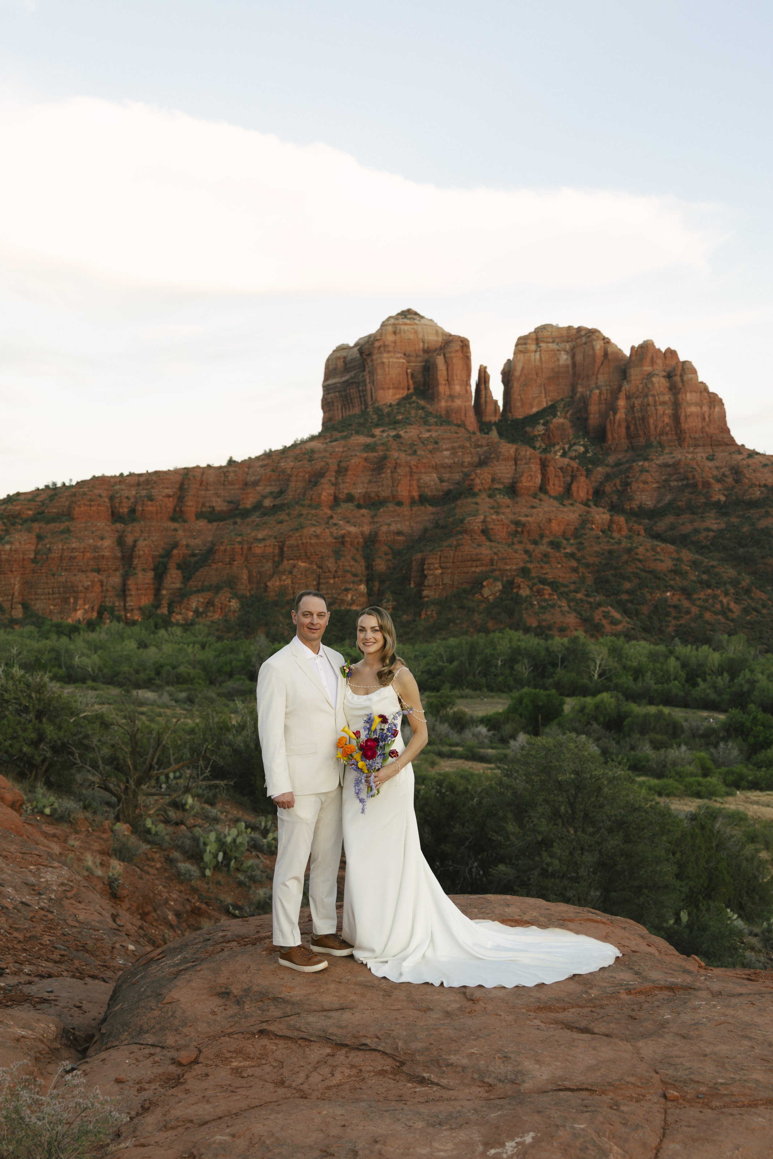 Romantic golden hour portraits at Secret Slick Rock during Chelsea and Travis' intimate Sedona elopement. Featuring Sedona's famous red rock views, stunning Arizona desert landscapes, and timeless wedding photography, these newlywed portraits perfect