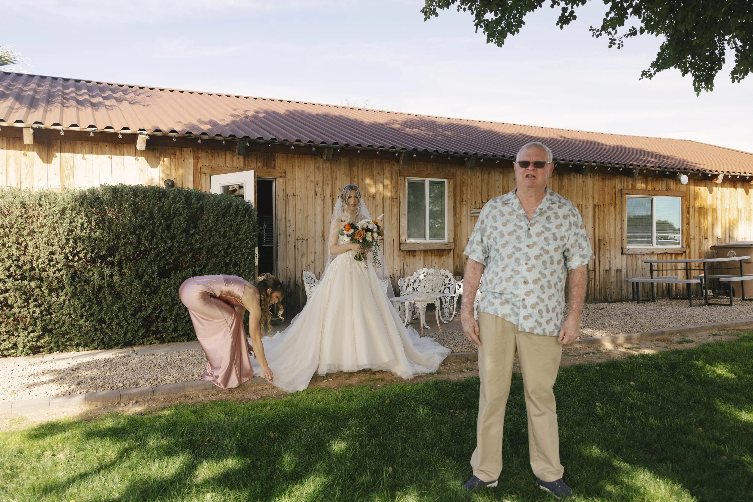 Candid wedding photography from a December wedding at The Knotty Barn in Queen Creek, Arizona, photographed by Raw By Laura, highlighting natural emotion, rustic details, and warm desert tones.
