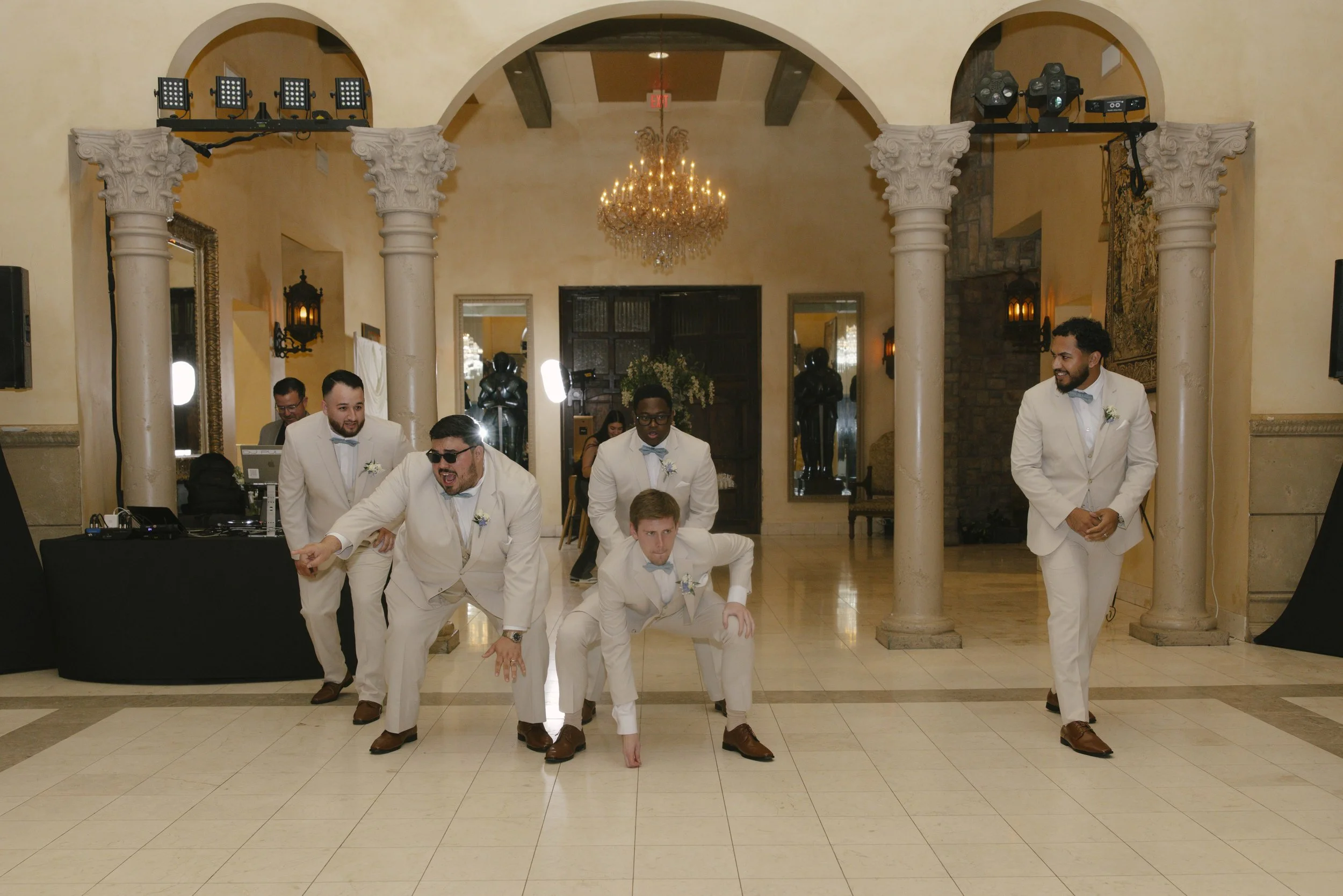 The reception celebration at Ashley Castle in Chandler, Arizona, came to life through hybrid film and digital photography, capturing elegant reception details, joyful bridal party entrances, and lively dance floor moments inside the castle’s grand ba