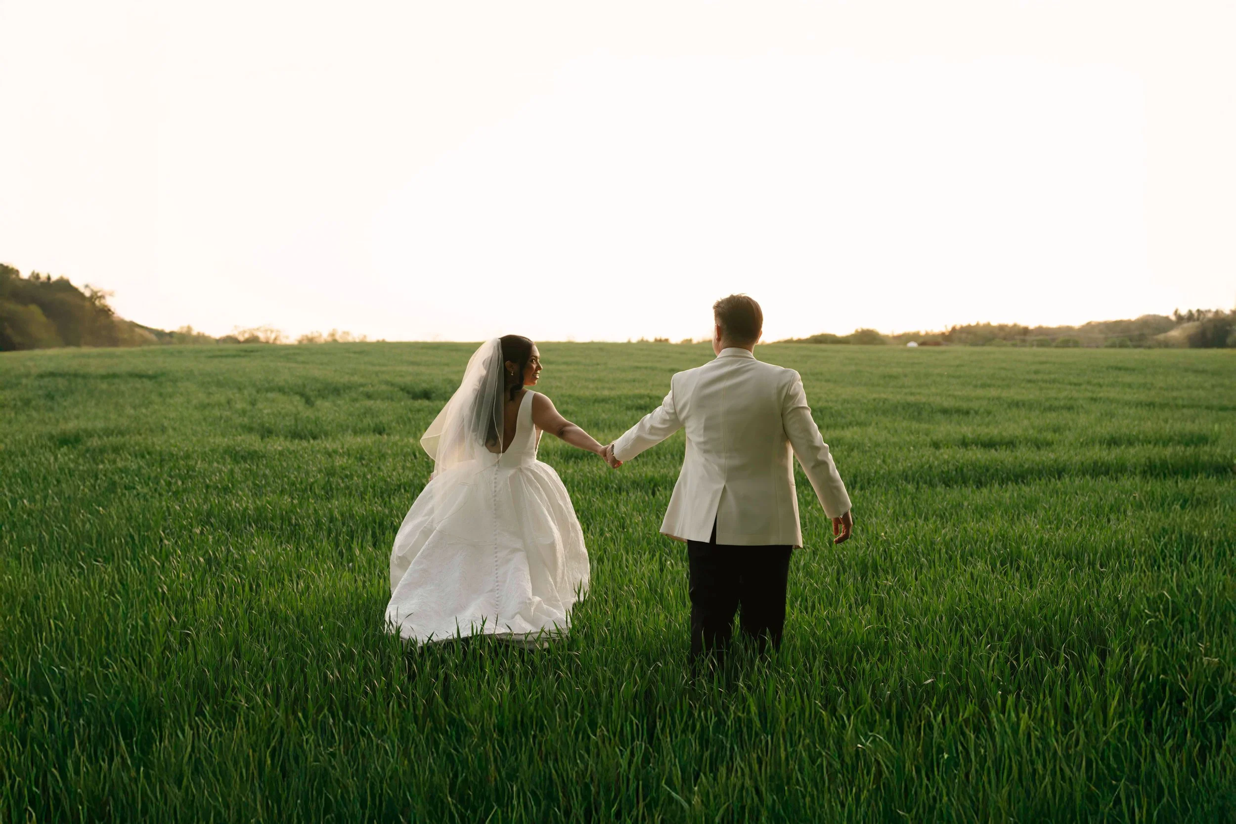 As the sun began to set, the bride and groom stepped away for golden hour portraits around the grounds of Hotel DuVillage. Captured on both digital and 35mm film, these sunset portraits highlight the warmth, romance, and quiet moments shared between 