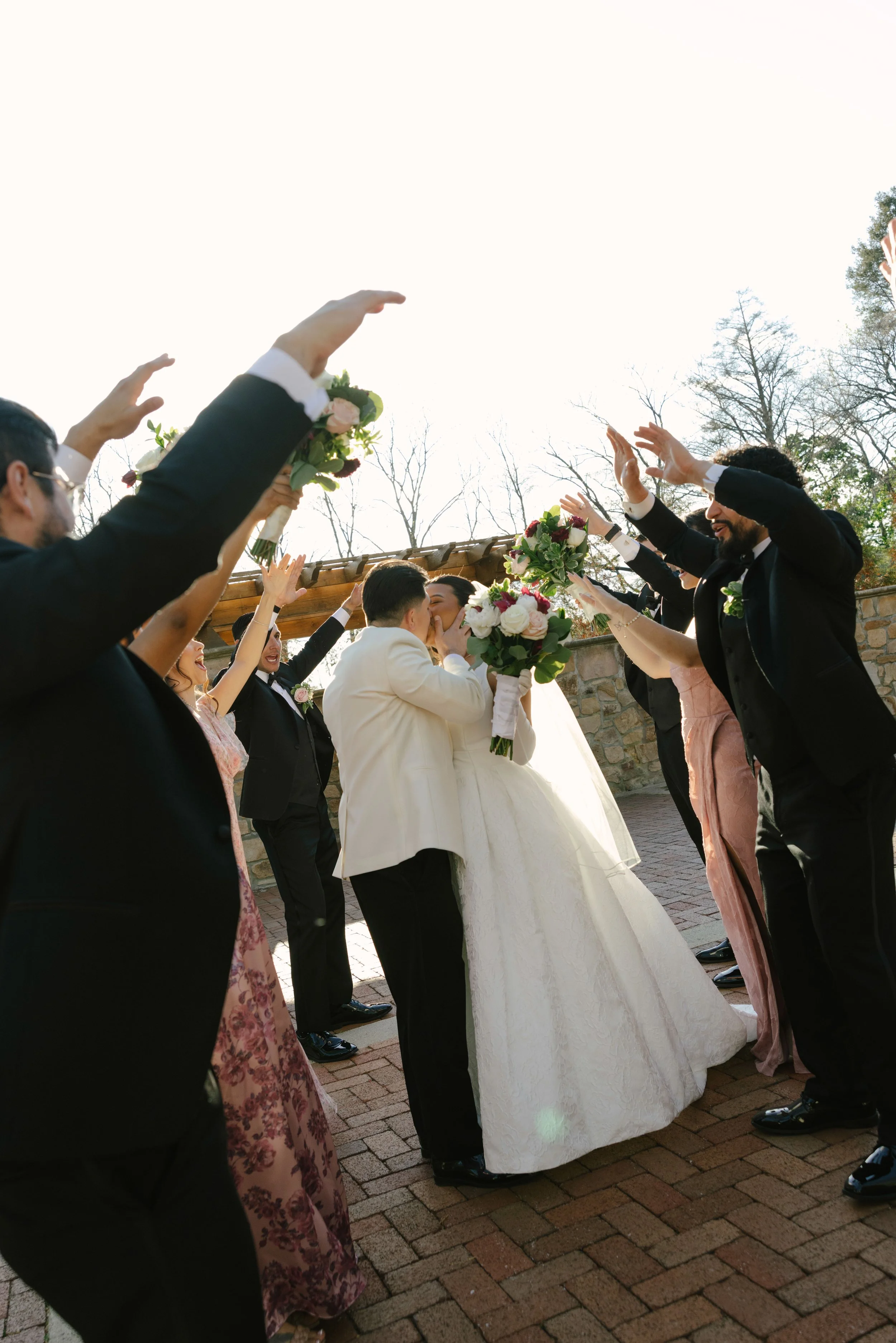 Bridal party portraits at Hotel DuVillage celebrate the bride and groom alongside their closest friends and family. Captured on digital and 35mm film, these images highlight genuine laughter, timeless portraits, and unforgettable moments.