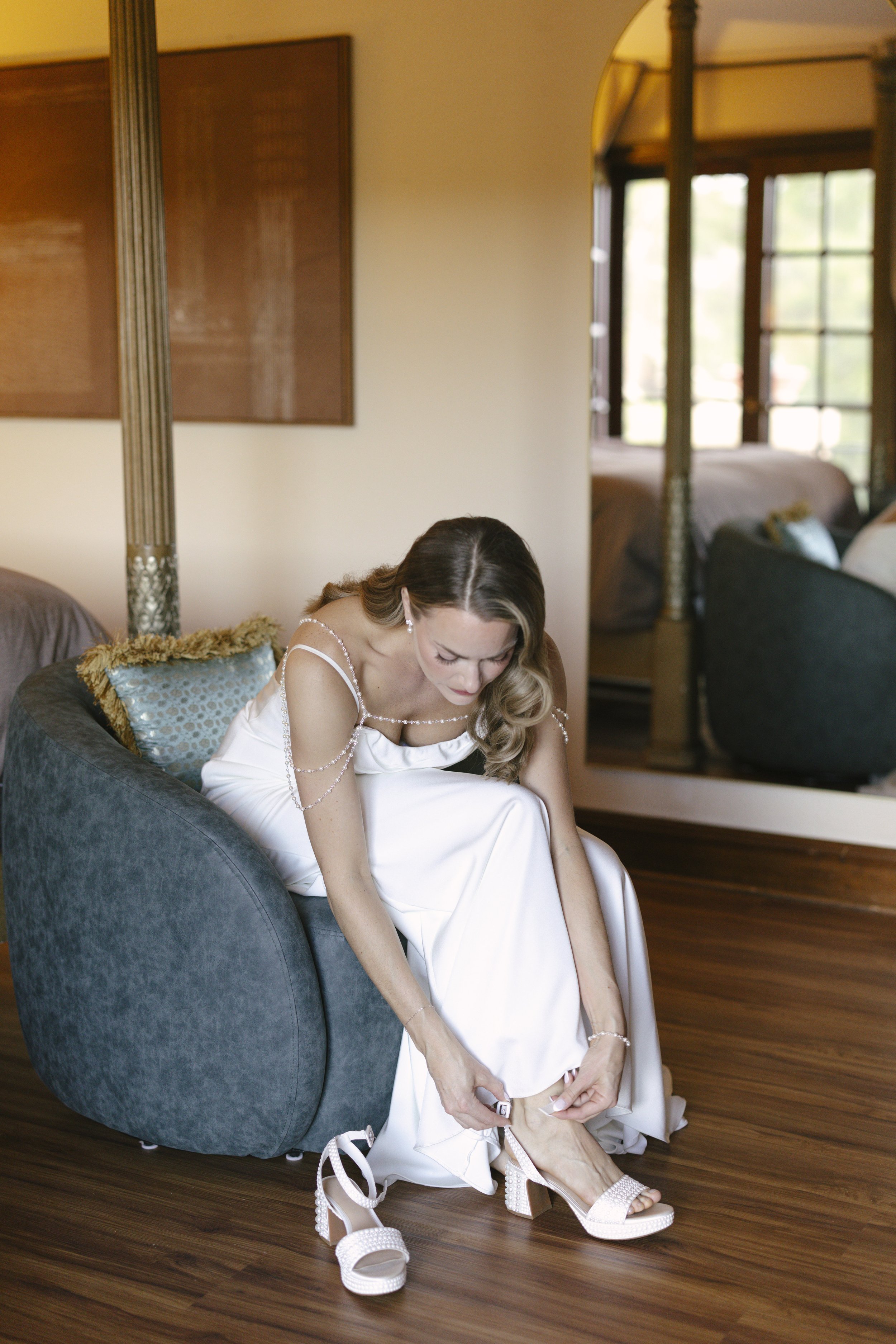 Chelsea and Travis' intimate Sedona elopement continued with heartfelt bridal getting-ready moments as the bride shared meaningful time with her mother and closest loved ones. From fastening her wedding dress and adding the finishing touches to quiet