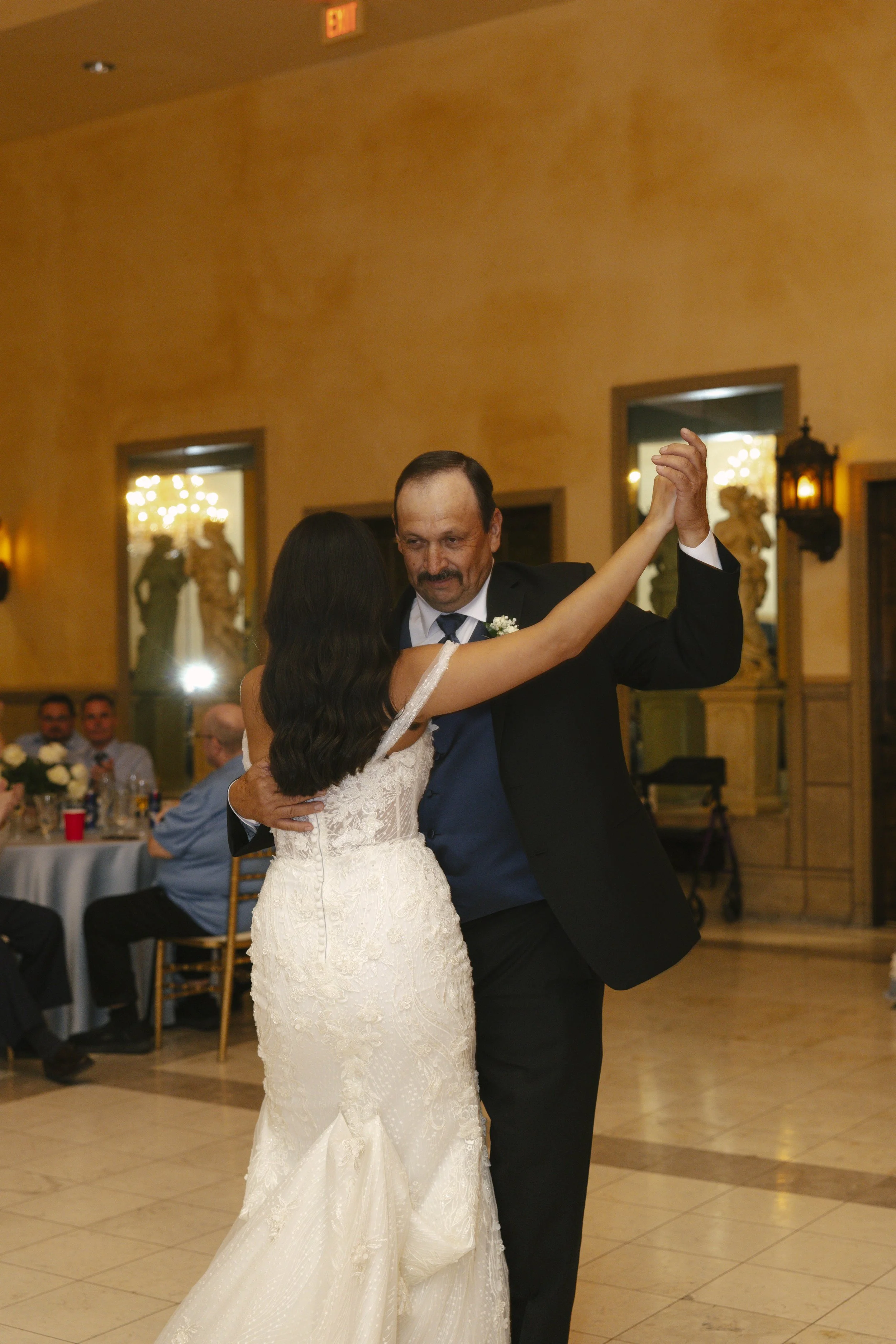 The reception celebration at Ashley Castle in Chandler, Arizona, came to life through hybrid film and digital photography, capturing elegant reception details, joyful bridal party entrances, and lively dance floor moments inside the castle’s grand ba