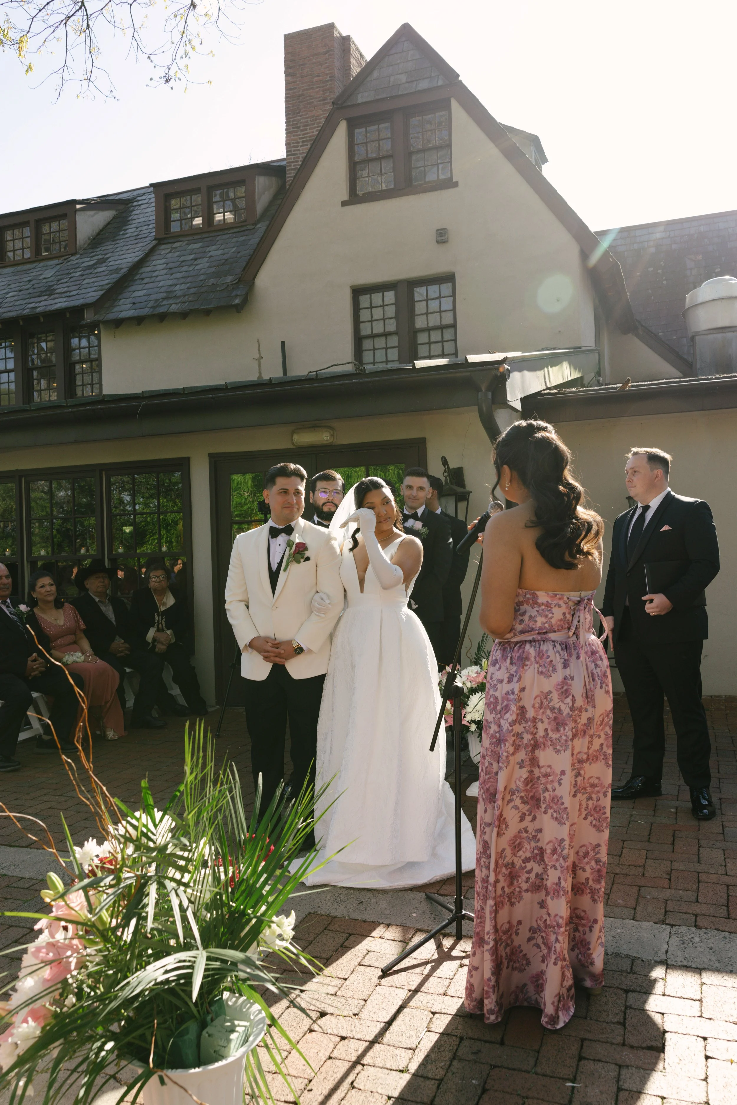 Outdoor wedding ceremony at Hotel DuVillage featuring the bride and groom, wedding party, and meaningful moments captured on both digital and 35mm film. A timeless celebration documented with a candid, documentary approach