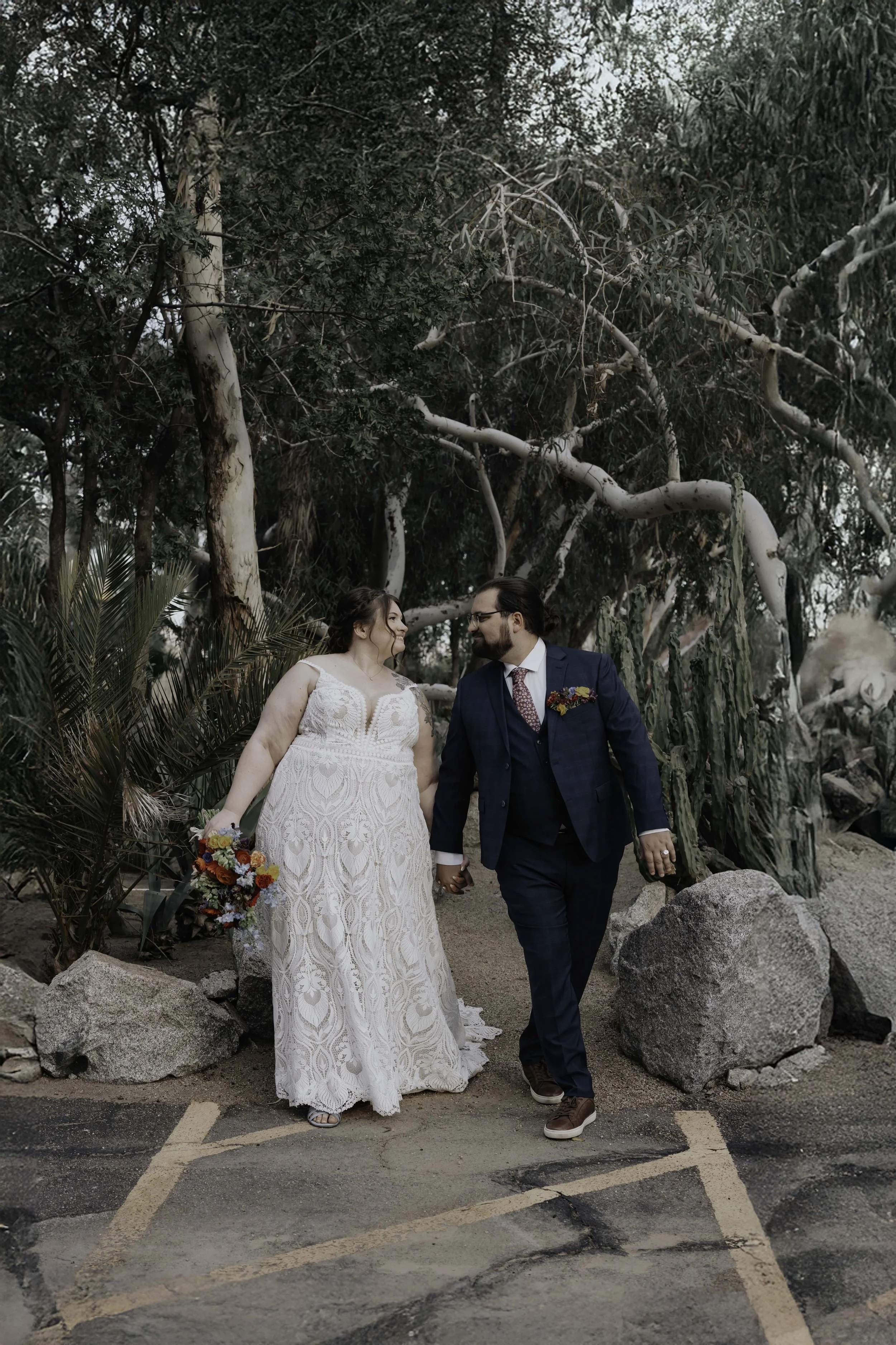 After the ceremony, Lauren and Joel explored the beautiful garden paths and adobe architecture of the Boojum Tree for their wedding portraits. Surrounded by desert greenery and warm Phoenix light, these moments captured the joy and excitement of thei