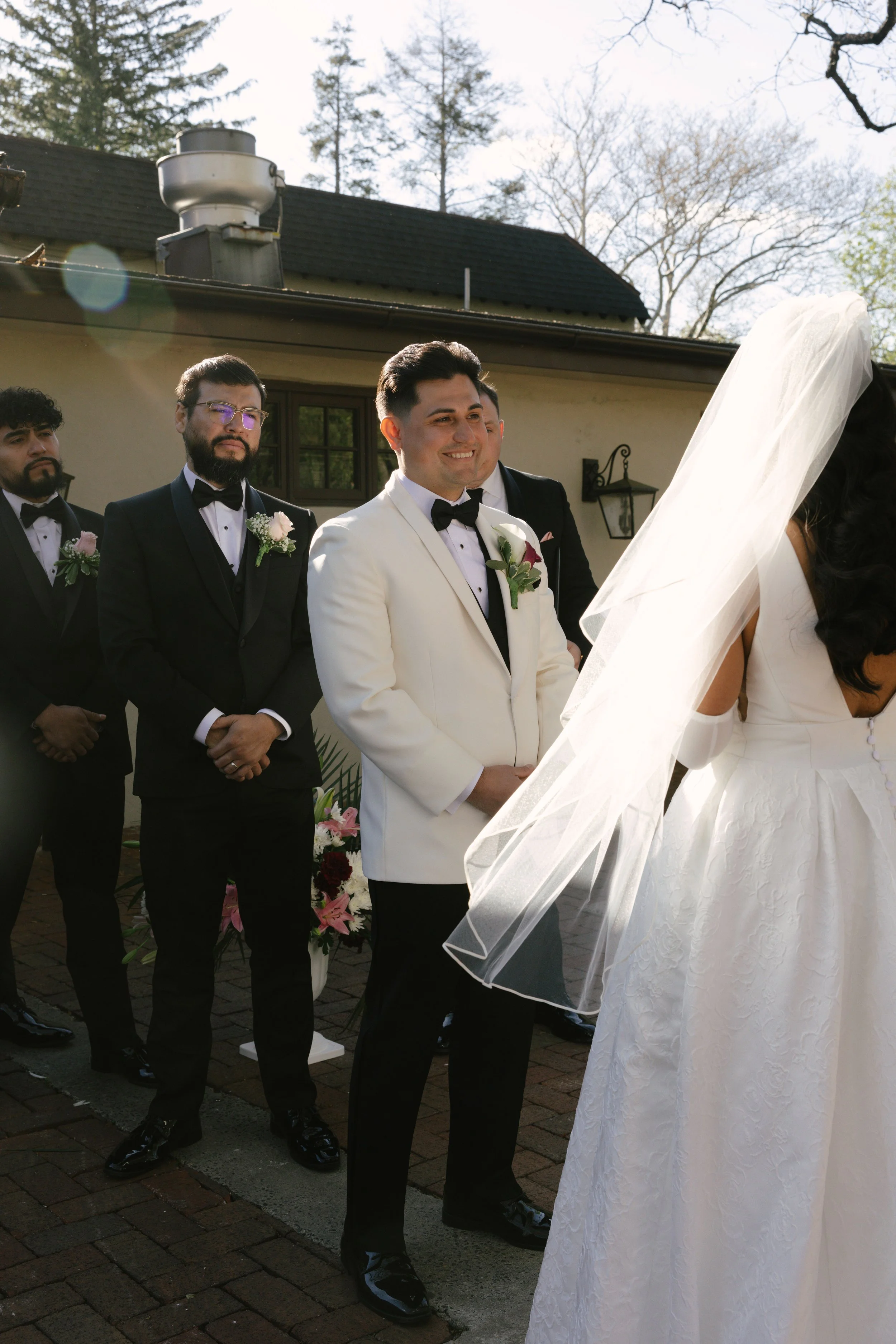 Outdoor wedding ceremony at Hotel DuVillage featuring the bride and groom, wedding party, and meaningful moments captured on both digital and 35mm film. A timeless celebration documented with a candid, documentary approach