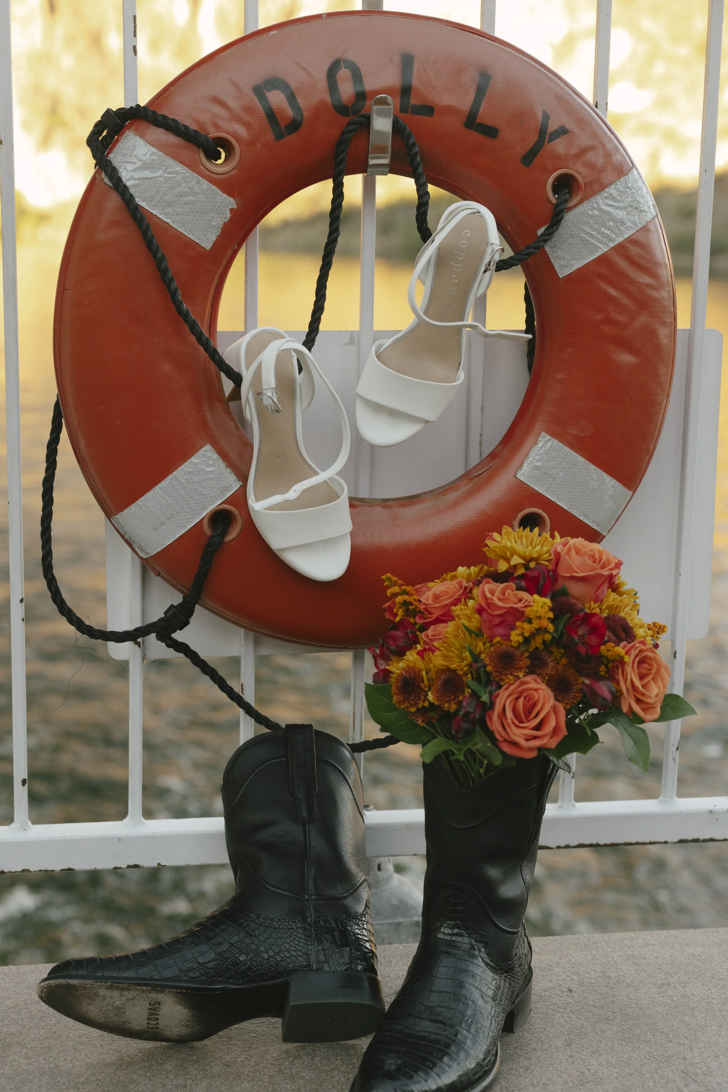 As the sun began to set over Canyon Lake, the couple stepped onto the deck of the Dolly Steamboat for golden hour portraits. With warm Arizona light reflecting off the water and desert mountains surrounding them, these quiet moments captured the beau