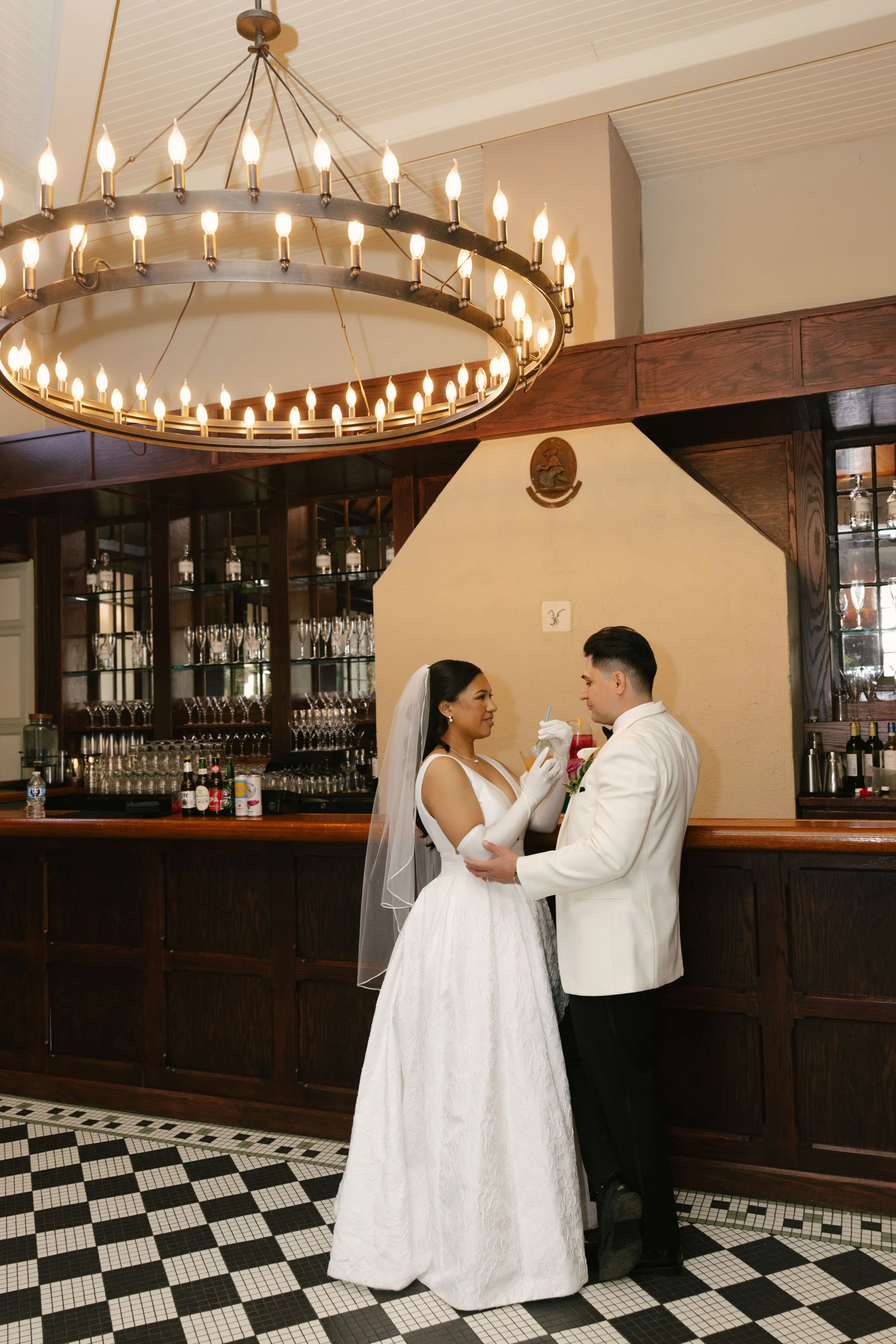Bride and groom portraits at Hotel DuVillage showcase the venue's picturesque gardens, waterfront views, and timeless charm. Photographed on both digital and 35mm film, these wedding portraits focus on authentic connection, natural movement, and cand