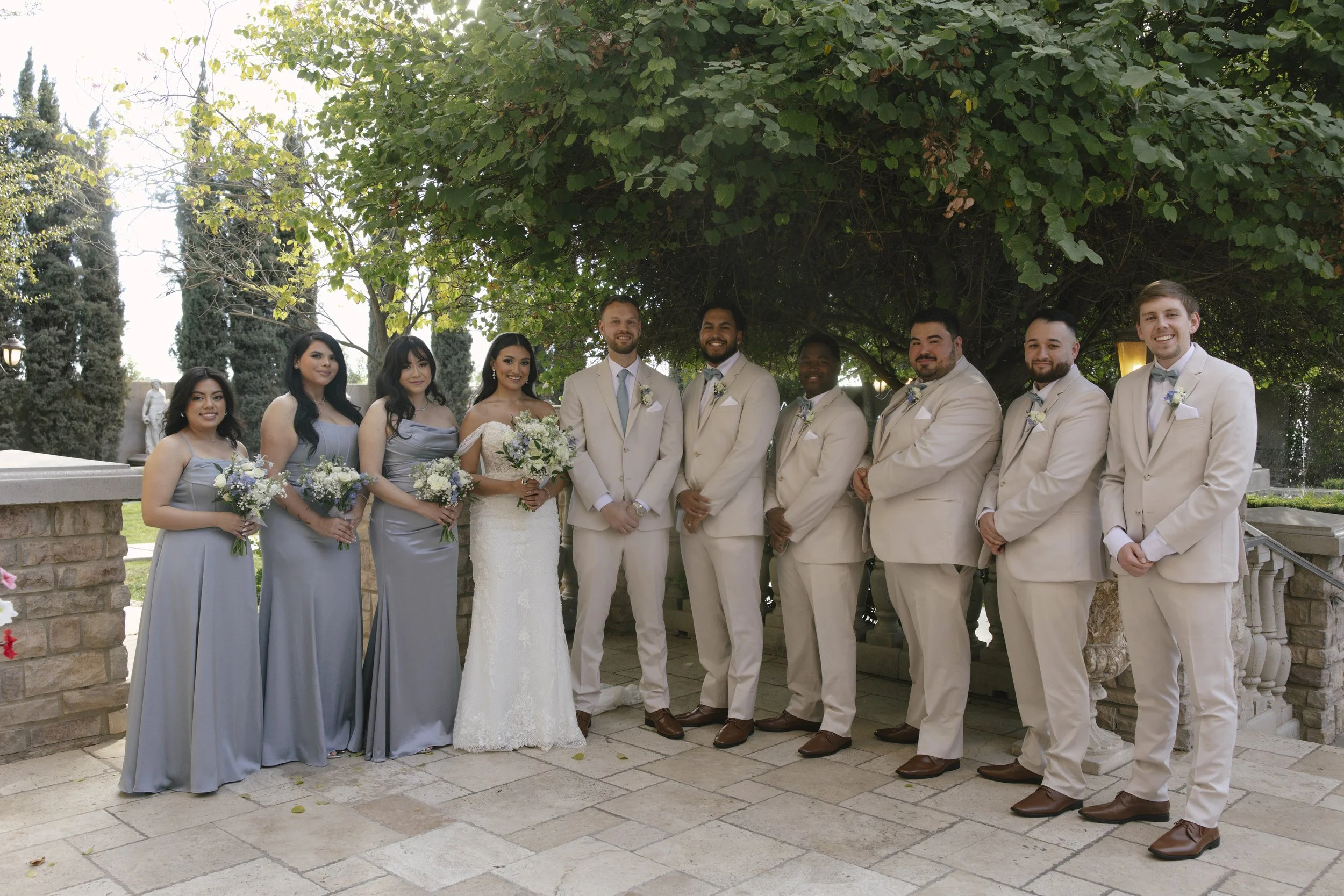 The bridal party portraits at Ashley Castle in Chandler, Arizona, brought playful energy and celebration to the day, with hybrid film and digital photography capturing candid laughter, stylish group moments, and unforgettable memories with the bride,