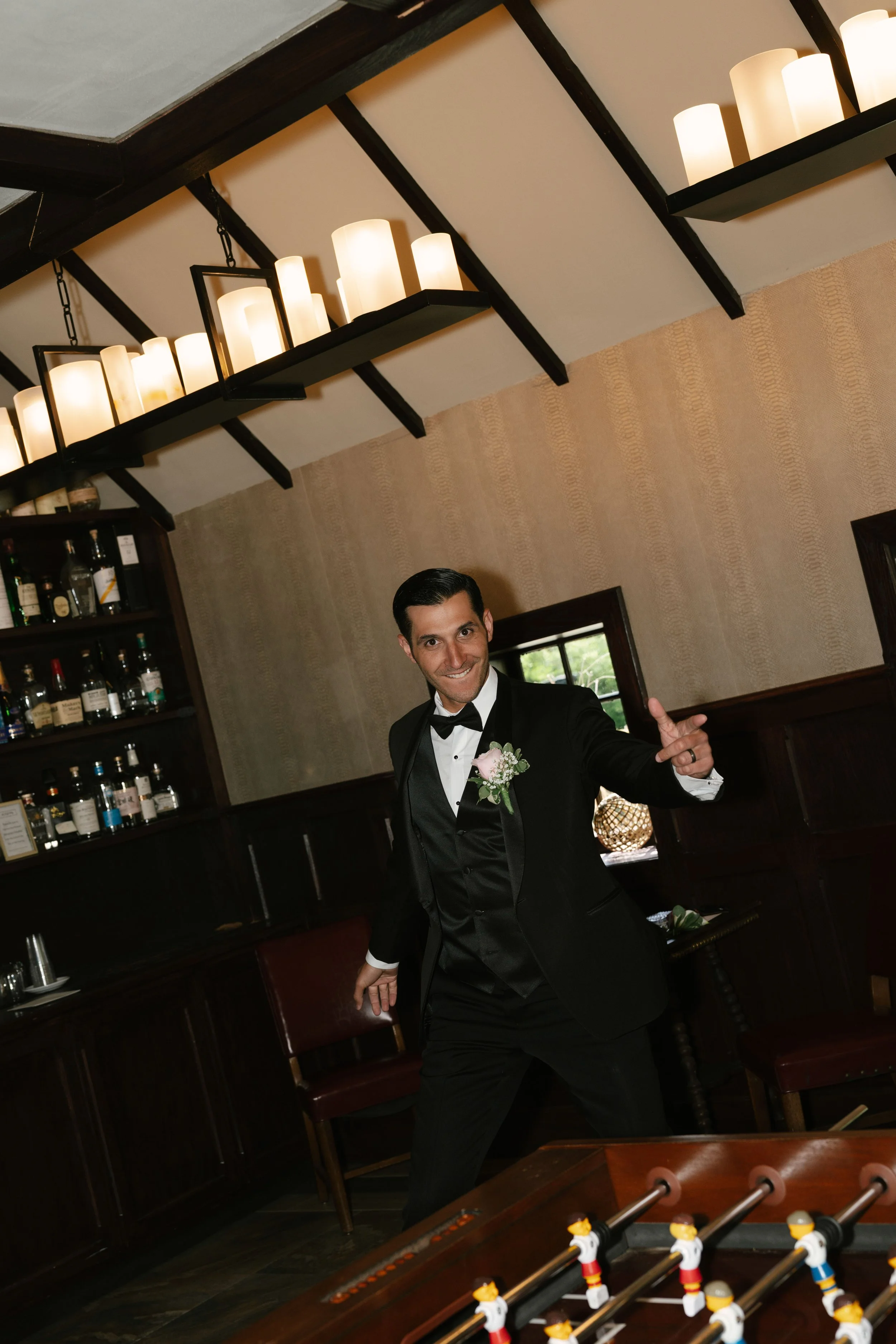 Groom getting ready at Hotel DuVillage before Andy & Elmer's May 2026 wedding. Captured by Raw By Laura using a blend of digital and 35mm film photography, documenting genuine moments with family and friends.