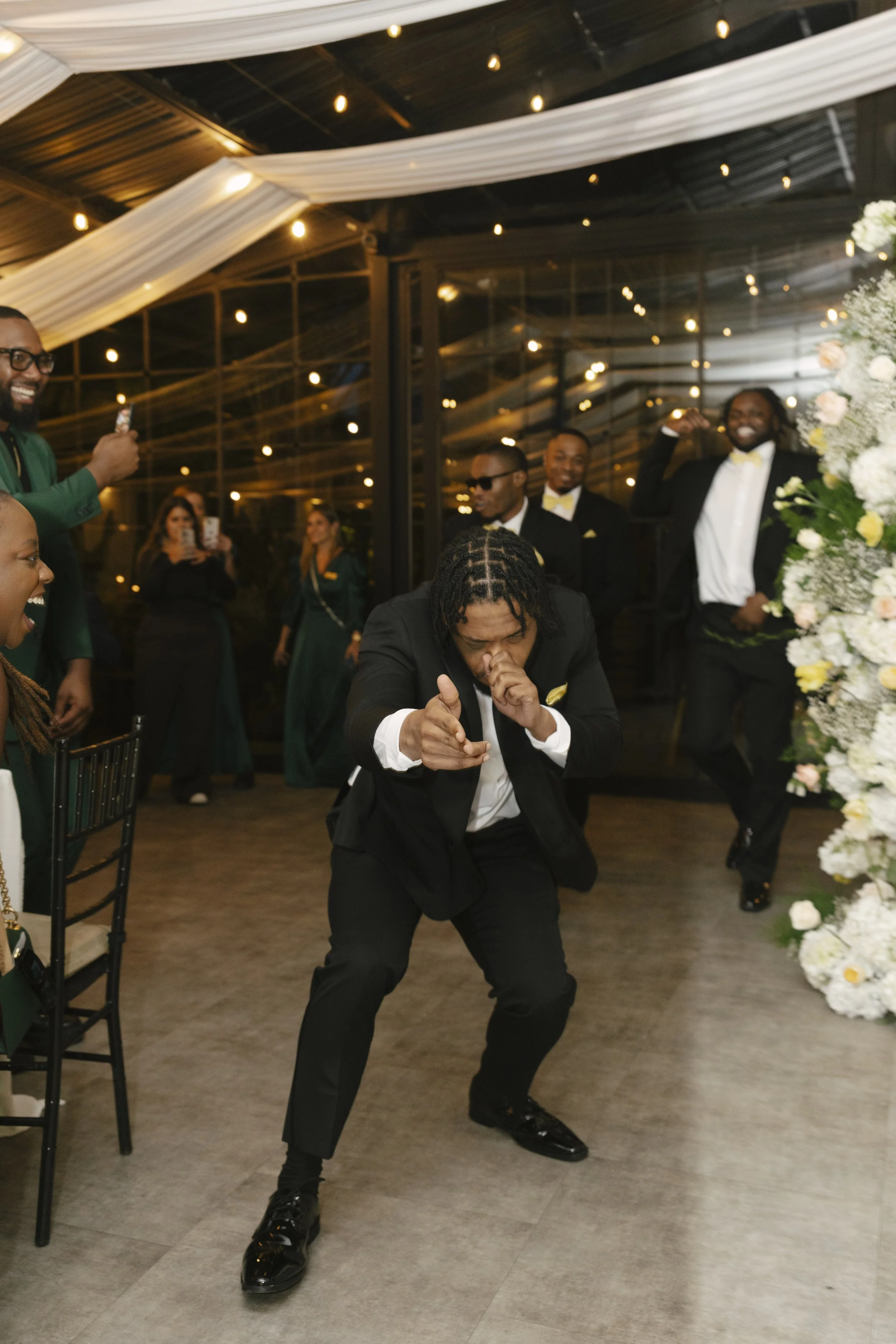 Wedding reception details at Forest Campestre in Medellín, Colombia featuring elegant reception décor, floral tablescapes, wedding cake, custom signage, first dance, and lively celebration captured through documentary wedding photography