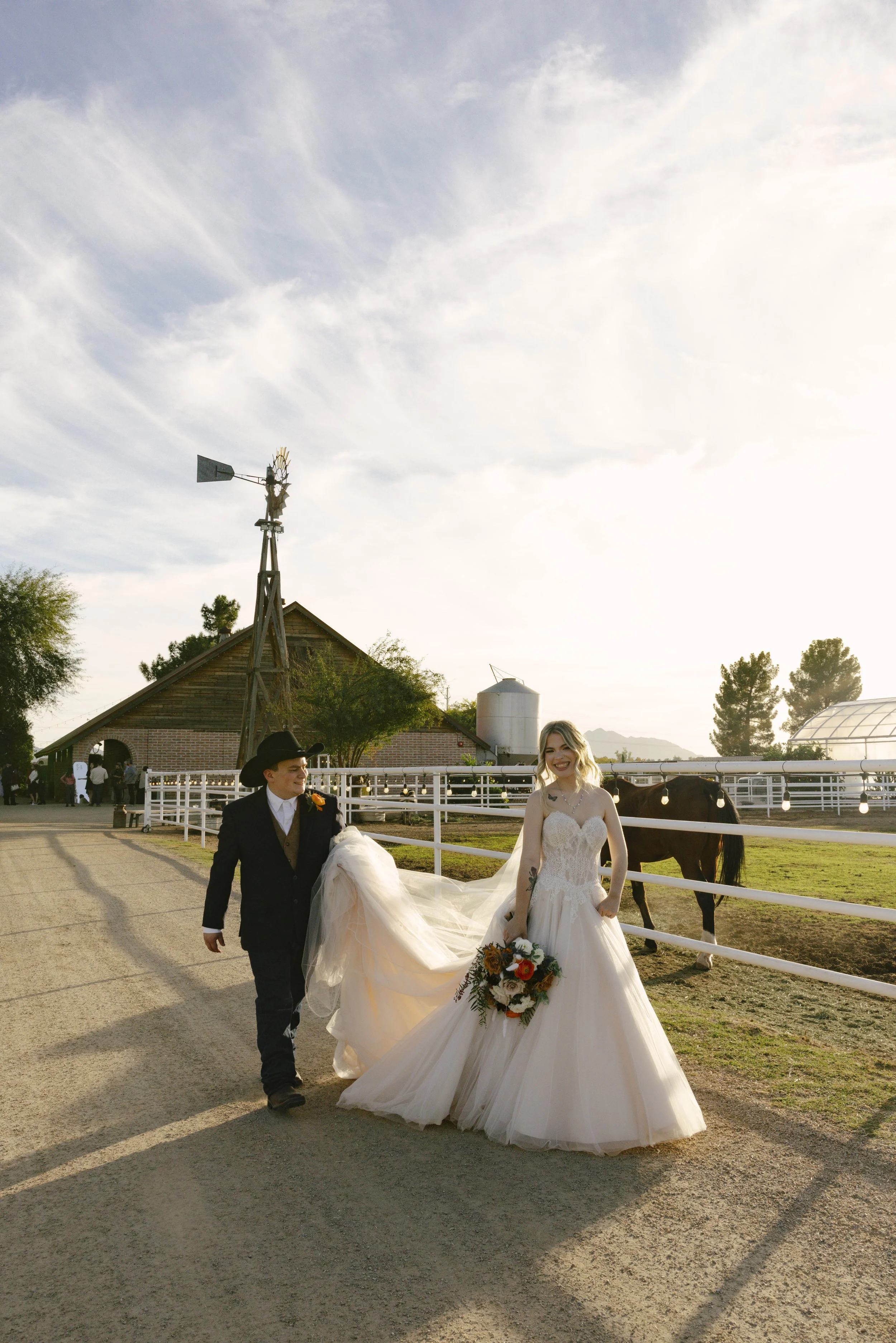 Documentary wedding photography at The Knotty Barn in Queen Creek, Arizona, captured by Arizona wedding photographer Raw By Laura, showcasing authentic moments, desert scenery, and a rustic western wedding setting.