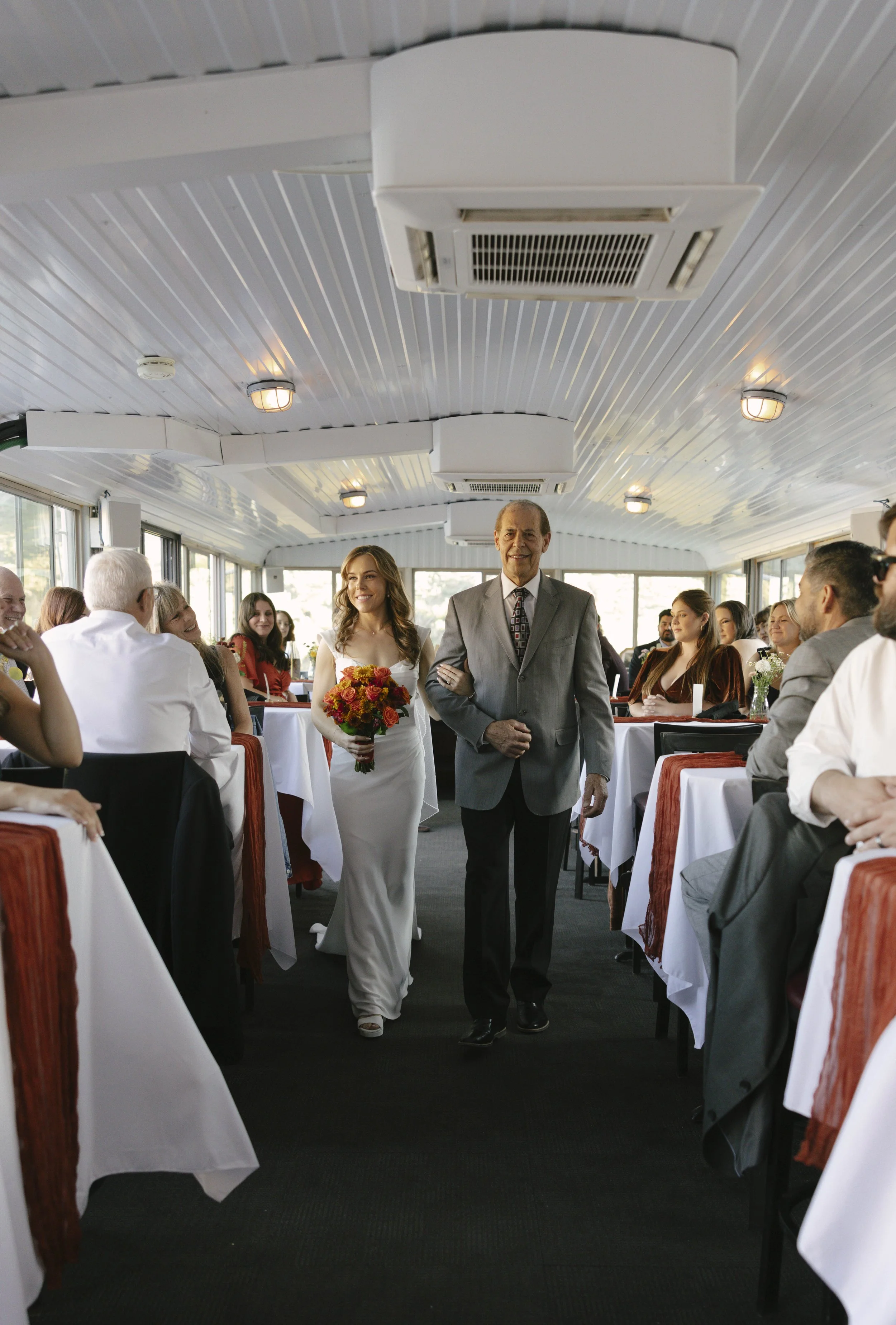 With Canyon Lake’s towering desert cliffs surrounding them, the couple exchanged rings and said “I do” aboard the Dolly Steamboat. Surrounded by about 60 of their closest friends and family, the ceremony took place on the deck with breathtaking Arizo