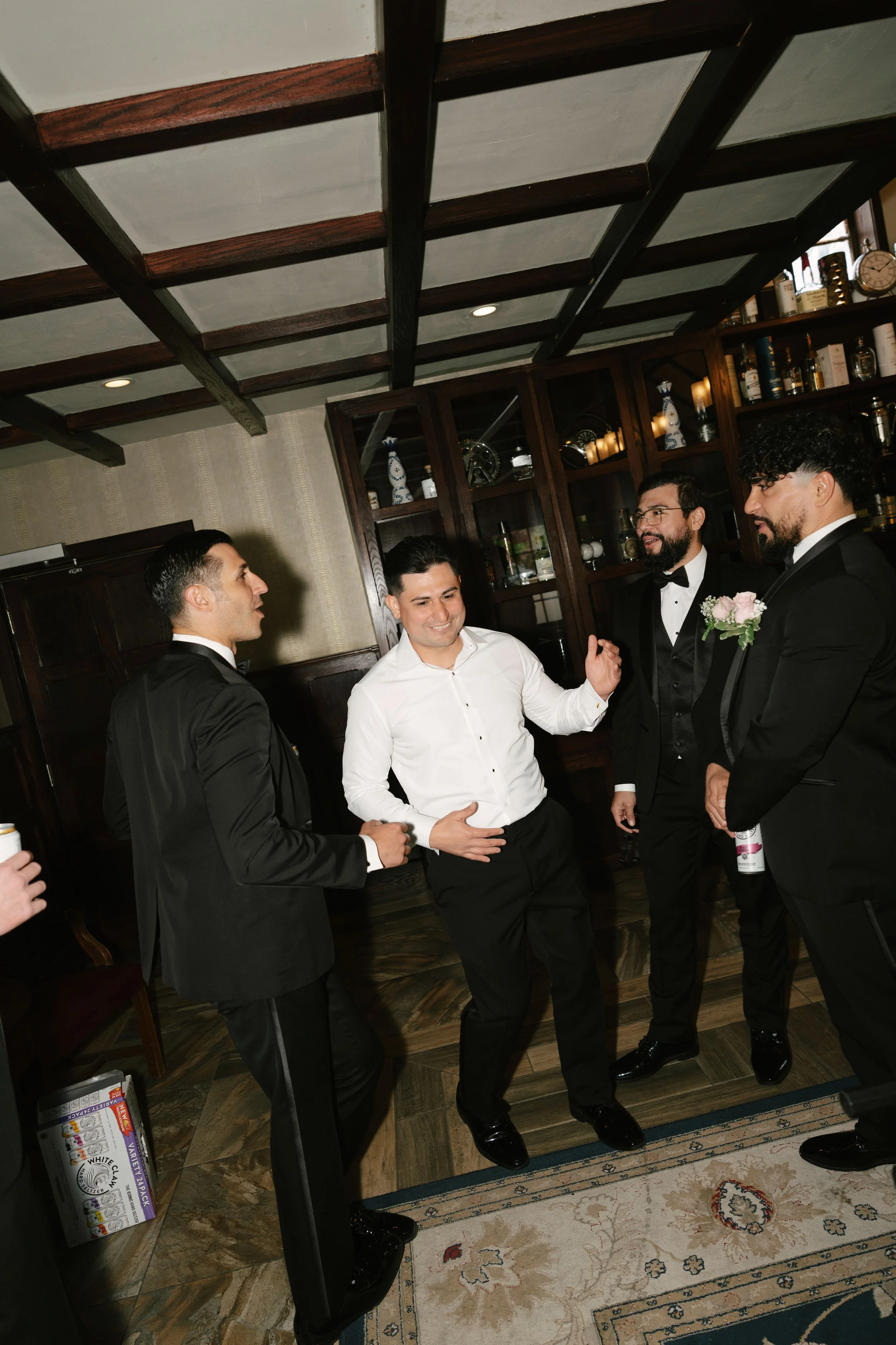 Groom getting ready at Hotel DuVillage before Andy & Elmer's May 2026 wedding. Captured by Raw By Laura using a blend of digital and 35mm film photography, documenting genuine moments with family and friends.