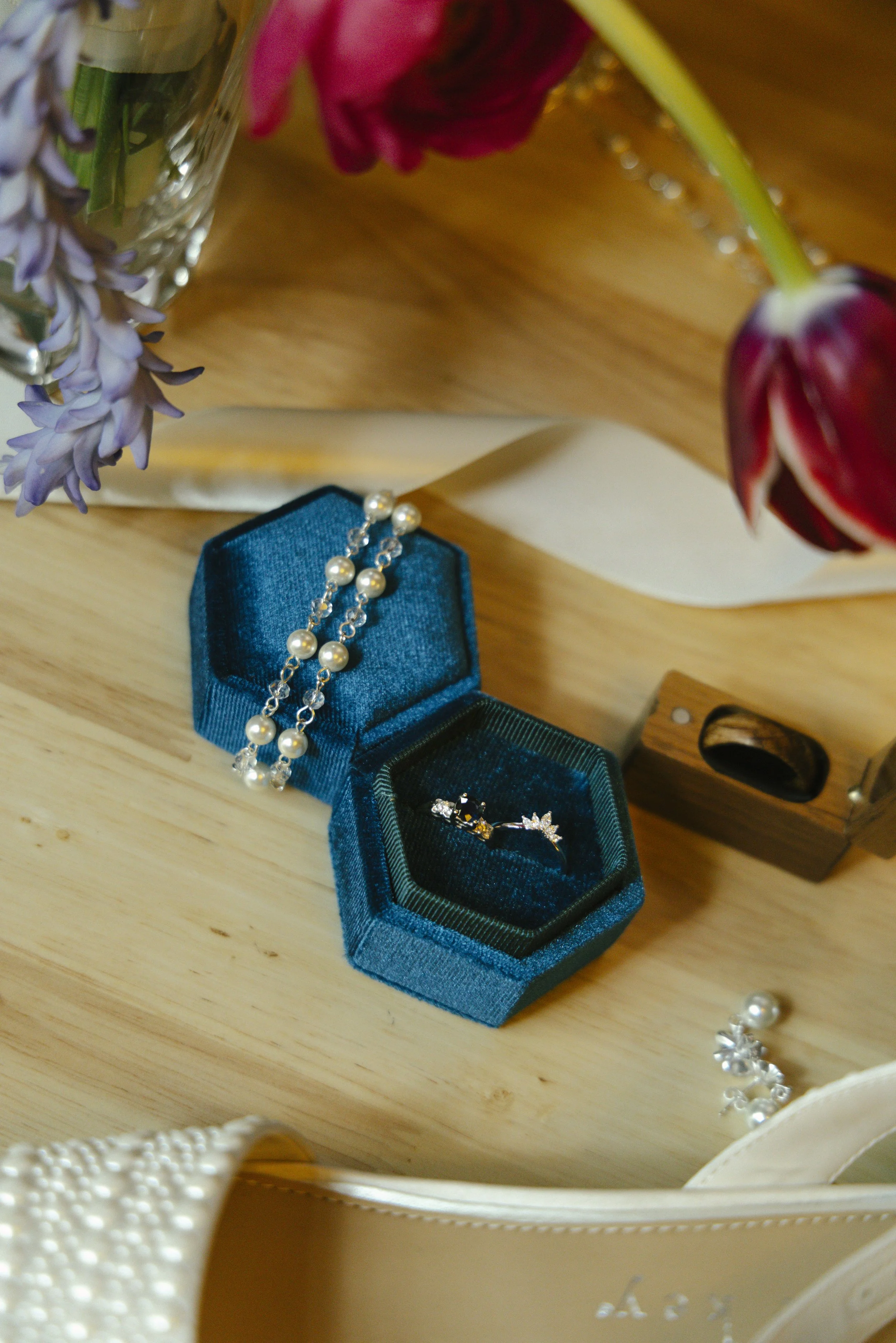 Elegant bridal details from Chelsea and Travis' intimate Sedona elopement, featuring the bride's wedding dress, shoes, rings, jewelry, and vibrant bouquet before getting ready for their private Arizona ceremony. Every carefully chosen detail reflecte