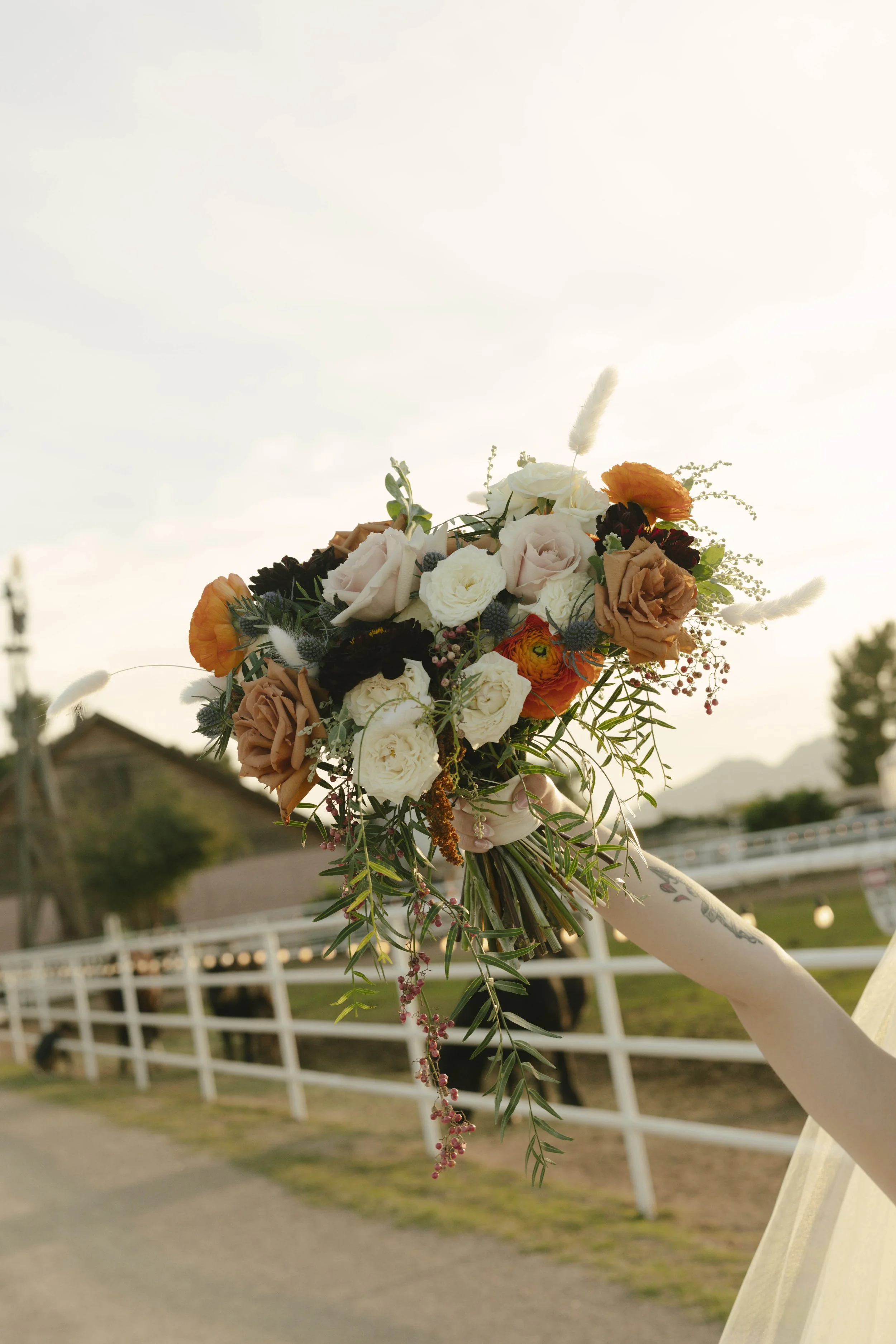 Documentary wedding photography at The Knotty Barn in Queen Creek, Arizona, captured by Arizona wedding photographer Raw By Laura, showcasing authentic moments, desert scenery, and a rustic western wedding setting.