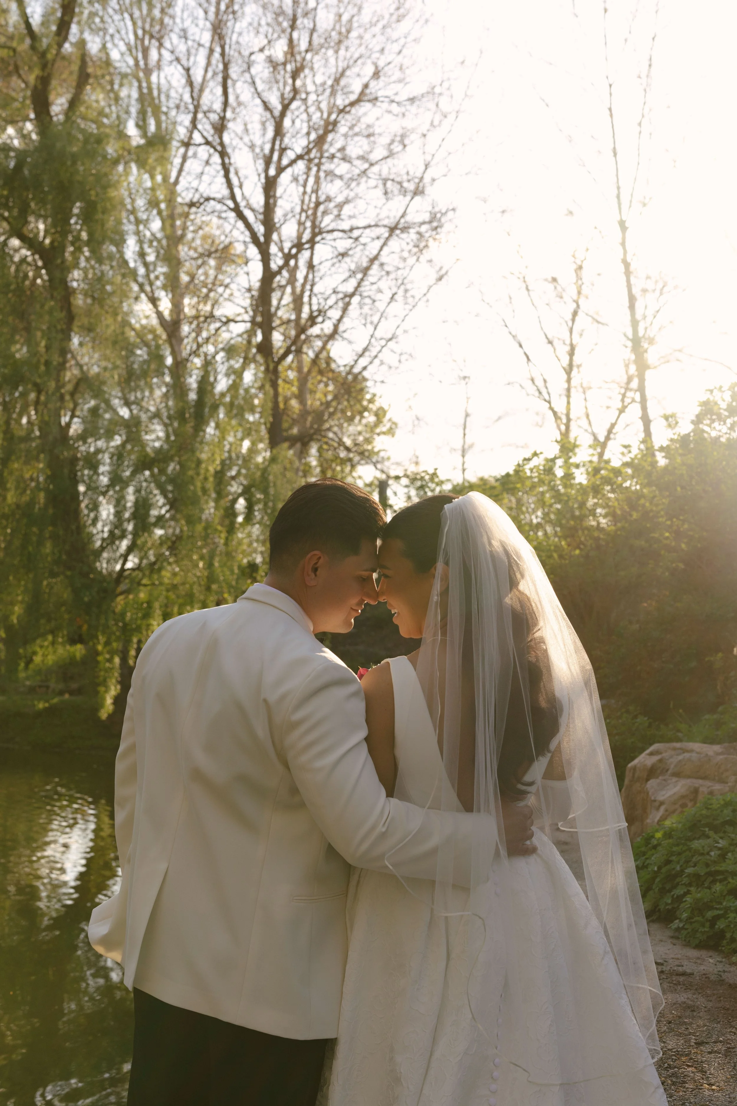 Bride and groom portraits at Hotel DuVillage showcase the venue's picturesque gardens, waterfront views, and timeless charm. Photographed on both digital and 35mm film, these wedding portraits focus on authentic connection, natural movement, and cand