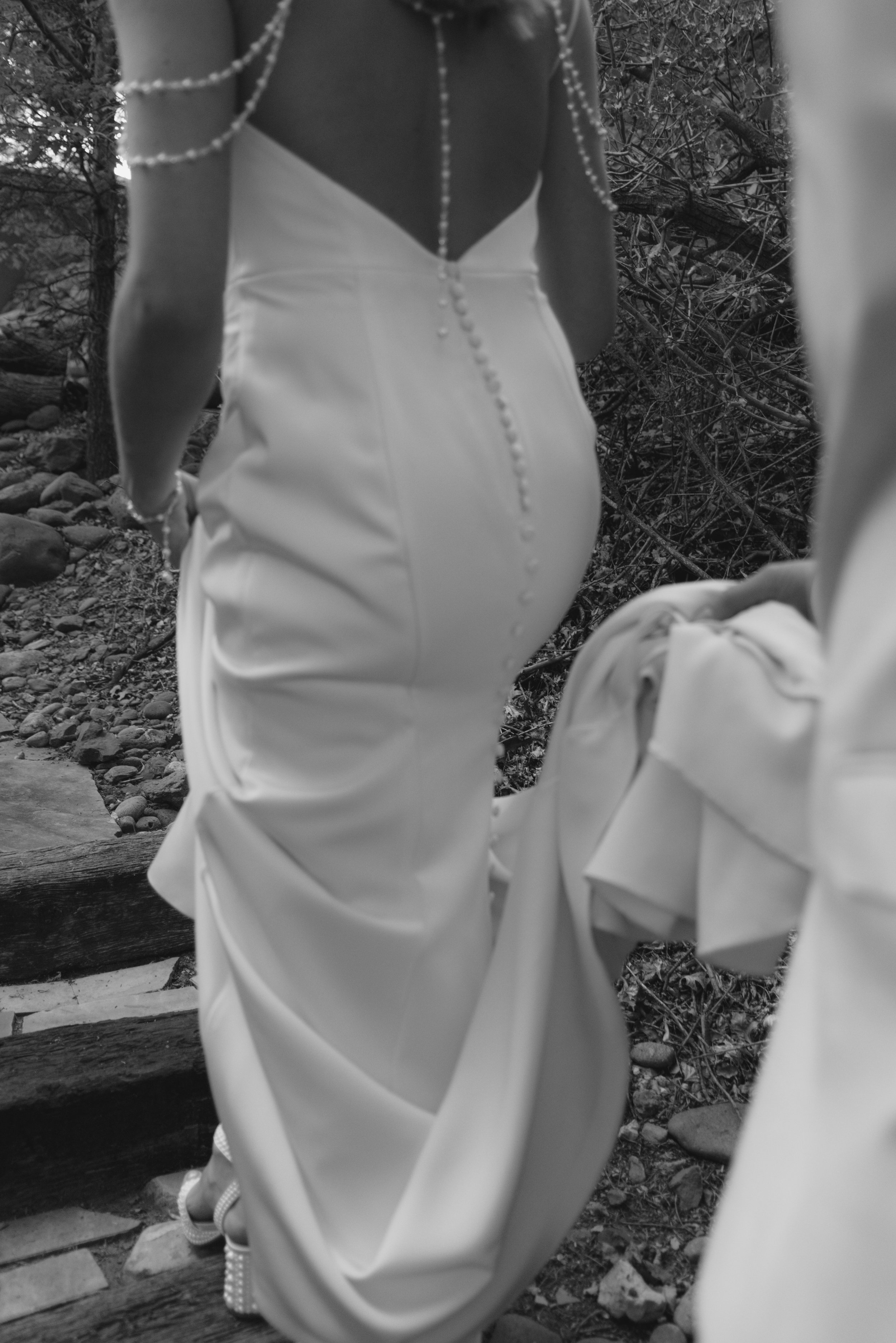Chelsea and Travis shared an intimate first look surrounded by the natural beauty of Sedona before exchanging vows during their private Arizona elopement ceremony. Set along a peaceful garden path, these heartfelt moments marked the beginning of thei