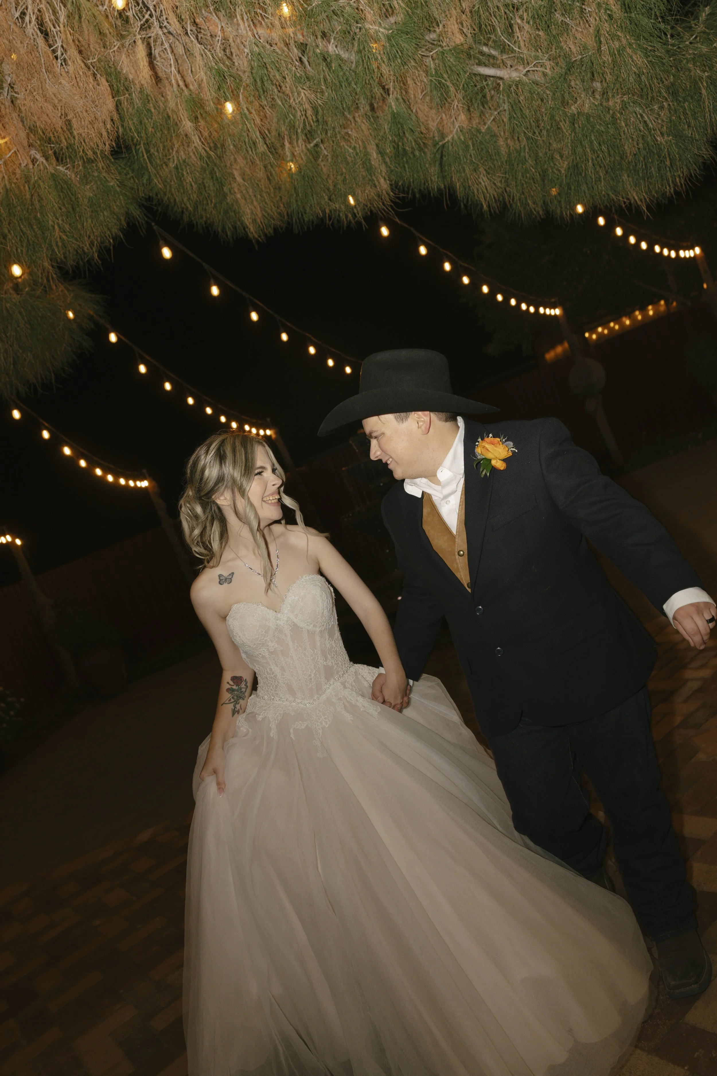 Documentary wedding photography at The Knotty Barn in Queen Creek, Arizona, captured by Arizona wedding photographer Raw By Laura, showcasing authentic moments, desert scenery, and a rustic western wedding setting.