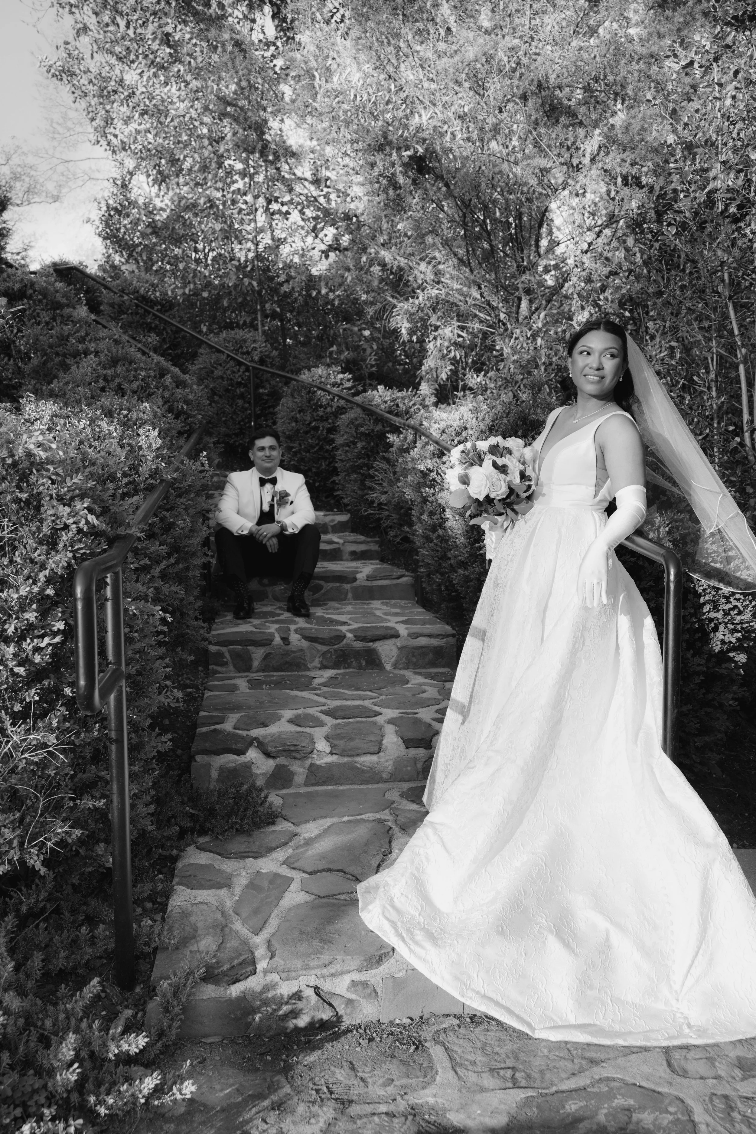 Bride and groom portraits at Hotel DuVillage showcase the venue's picturesque gardens, waterfront views, and timeless charm. Photographed on both digital and 35mm film, these wedding portraits focus on authentic connection, natural movement, and cand