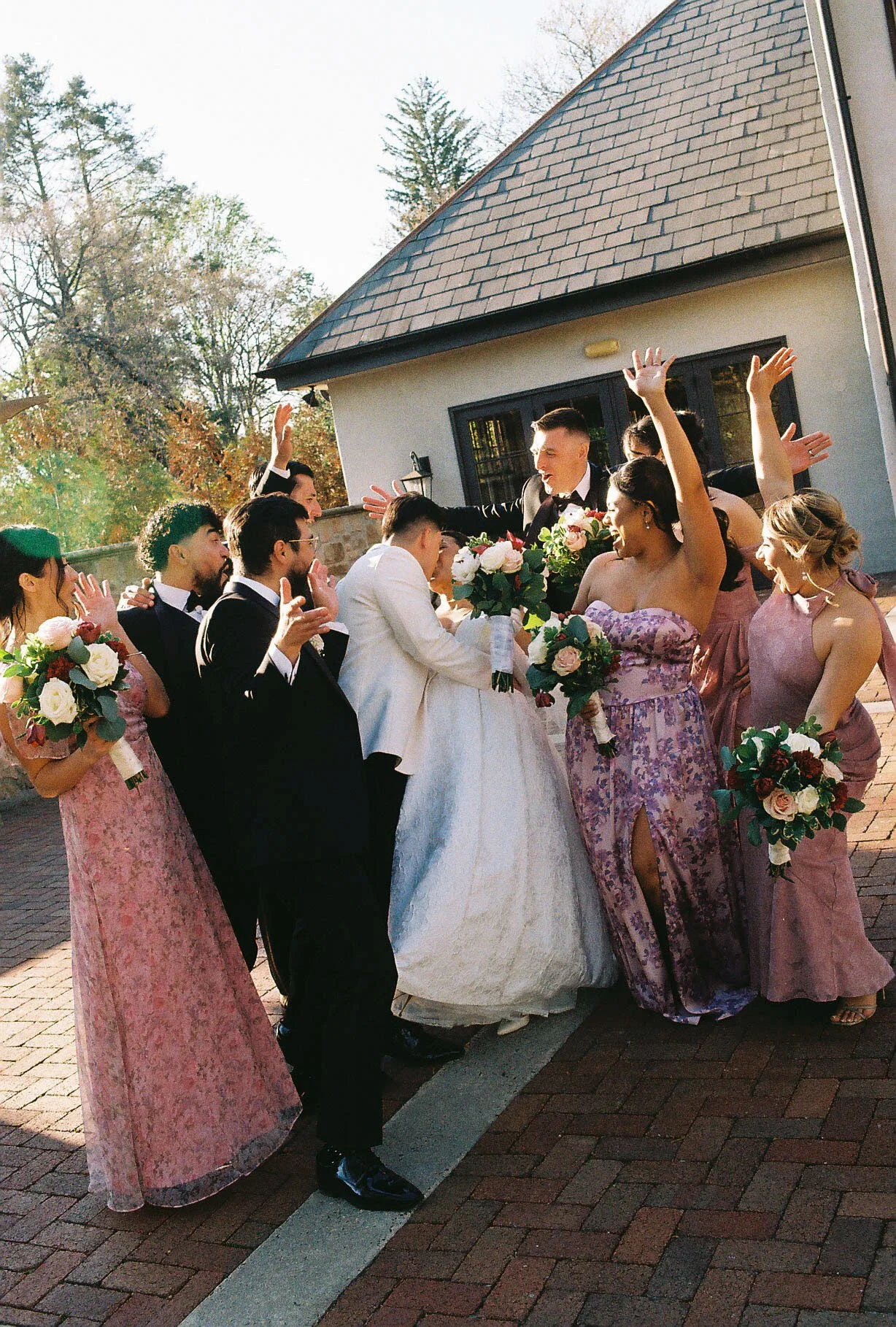 Bridal party portraits at Hotel DuVillage celebrate the bride and groom alongside their closest friends and family. Captured on digital and 35mm film, these images highlight genuine laughter, timeless portraits, and unforgettable moments.