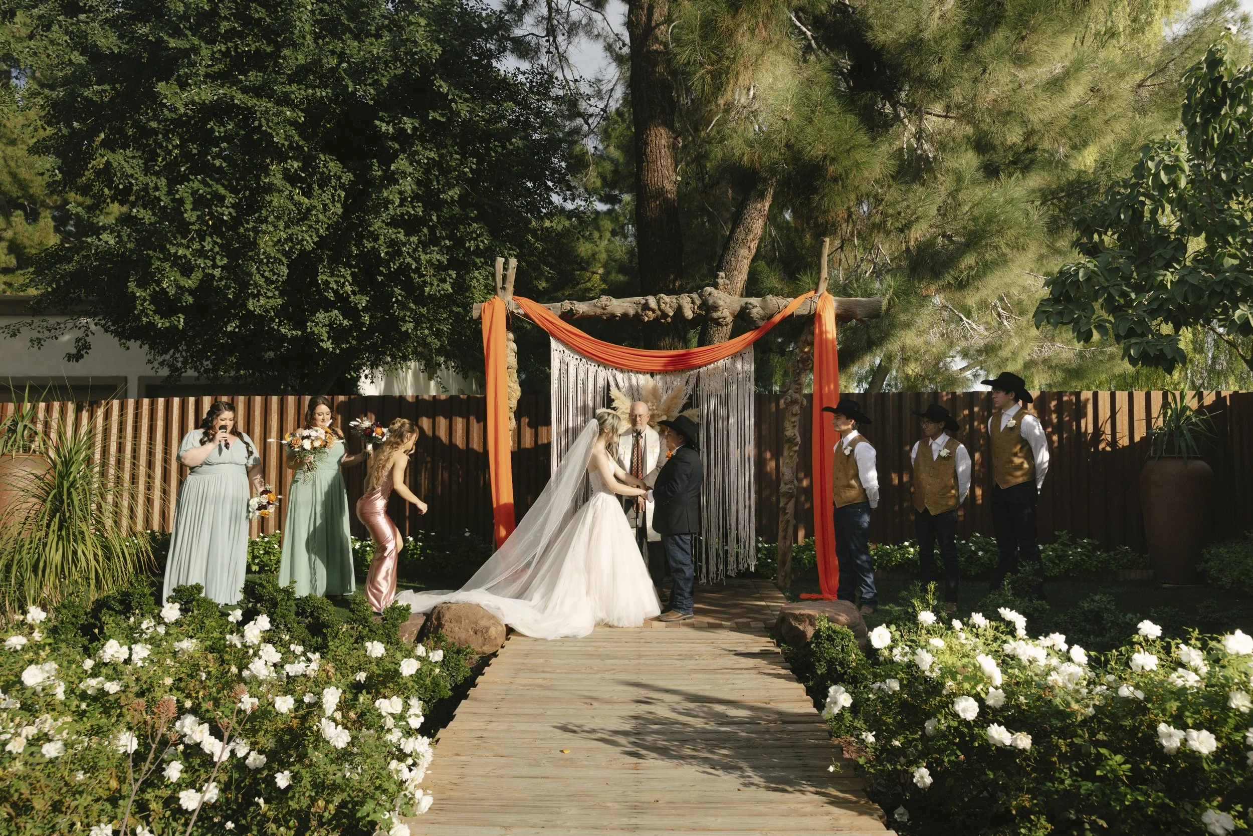 Documentary wedding photography at The Knotty Barn in Queen Creek, Arizona, captured by Arizona wedding photographer Raw By Laura, showcasing authentic moments, desert scenery, and a rustic western wedding setting.