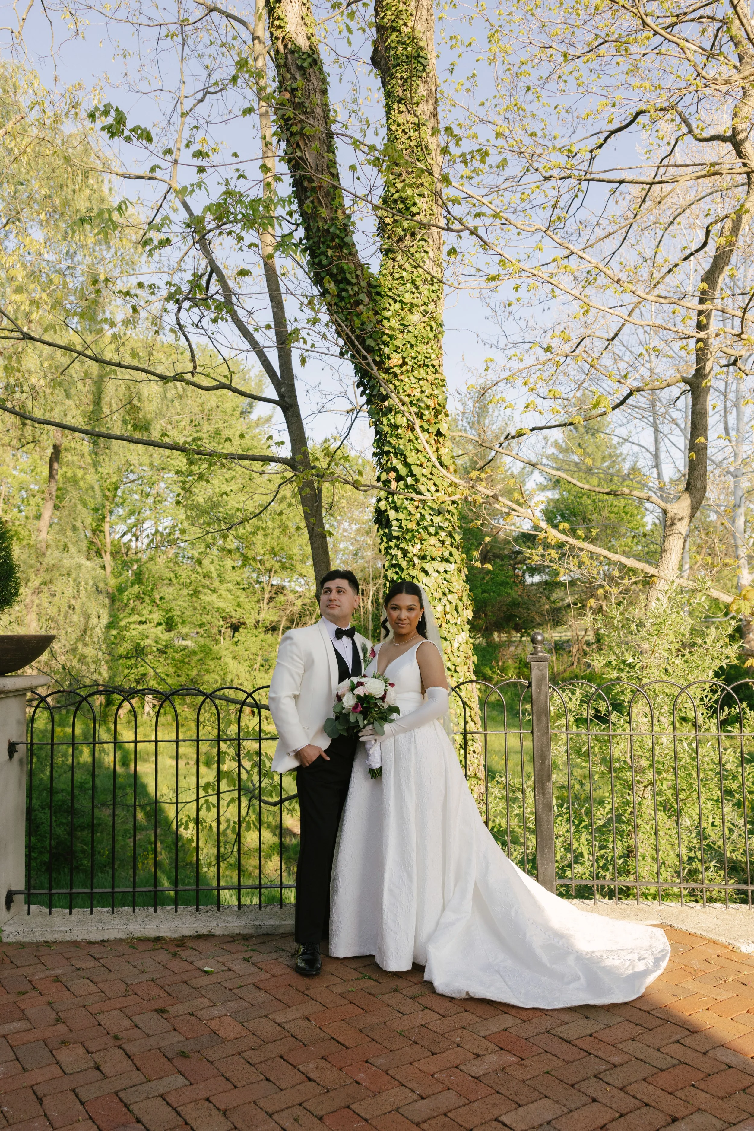 Bride and groom portraits at Hotel DuVillage showcase the venue's picturesque gardens, waterfront views, and timeless charm. Photographed on both digital and 35mm film, these wedding portraits focus on authentic connection, natural movement, and cand