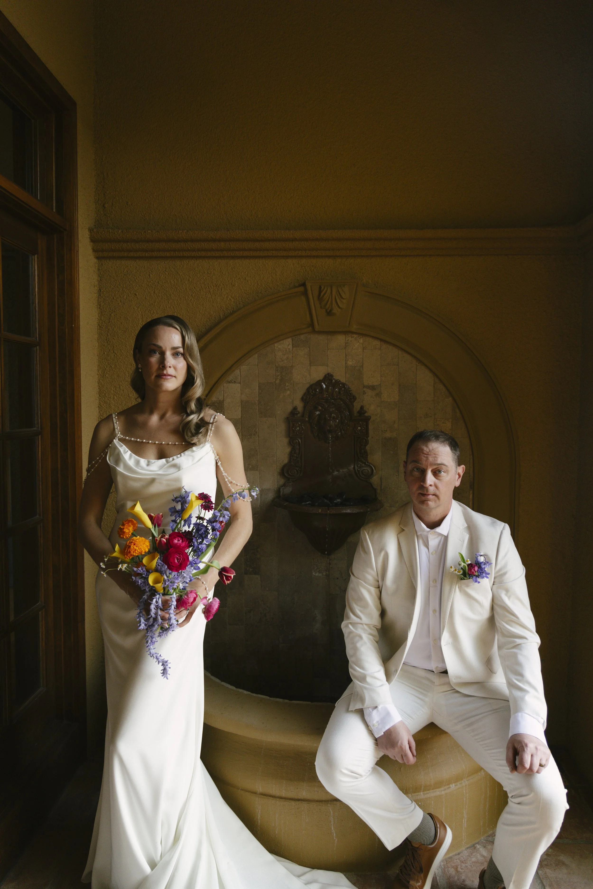 Romantic newlywed portraits from Chelsea and Travis' intimate Sedona, Arizona elopement, featuring elegant courtyard portraits, candid moments with their beloved dog, and timeless wedding photography captured after their private ceremony before golde