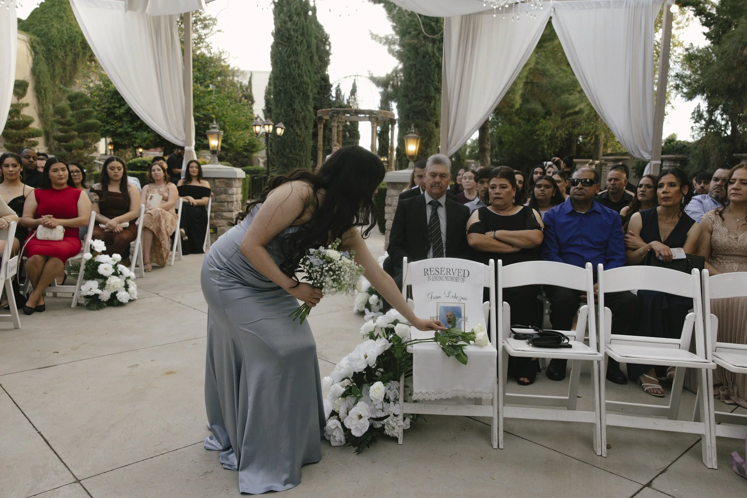 The wedding processional at Ashley Castle in Chandler, Arizona, was captured through hybrid film and digital photography, preserving the graceful entrances of the bridal party as they made their way through the romantic outdoor ceremony space surroun